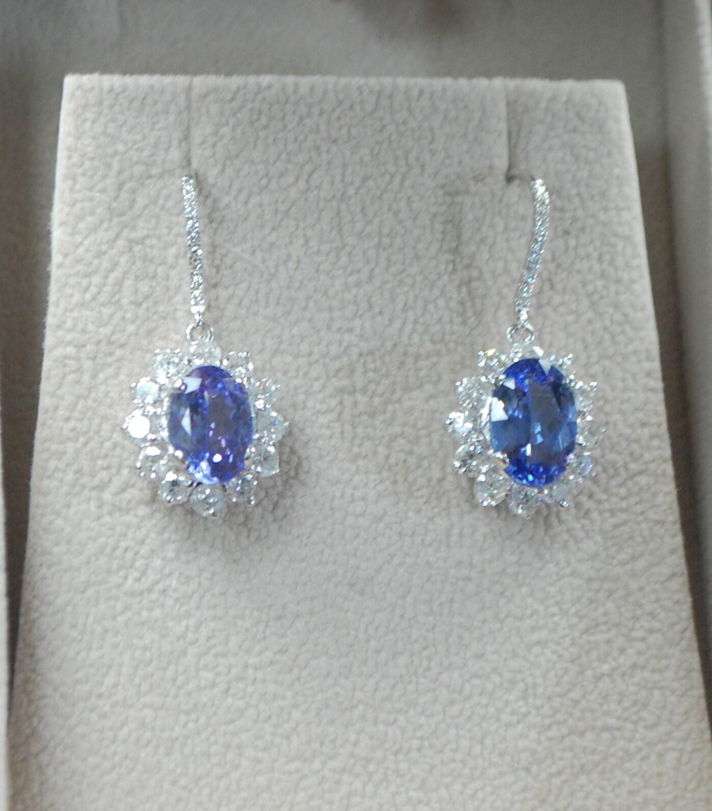 Luxurious cocktail tanzanite & diamond earrings in 18KT white gold, what a stunning sparkle these have, such a royal feel to them! 

Details:
Metal: 18KT white gold
Gemstone: Natural Tanzanite
Gemstone weight: 8ct center 
Gemstone shape:
