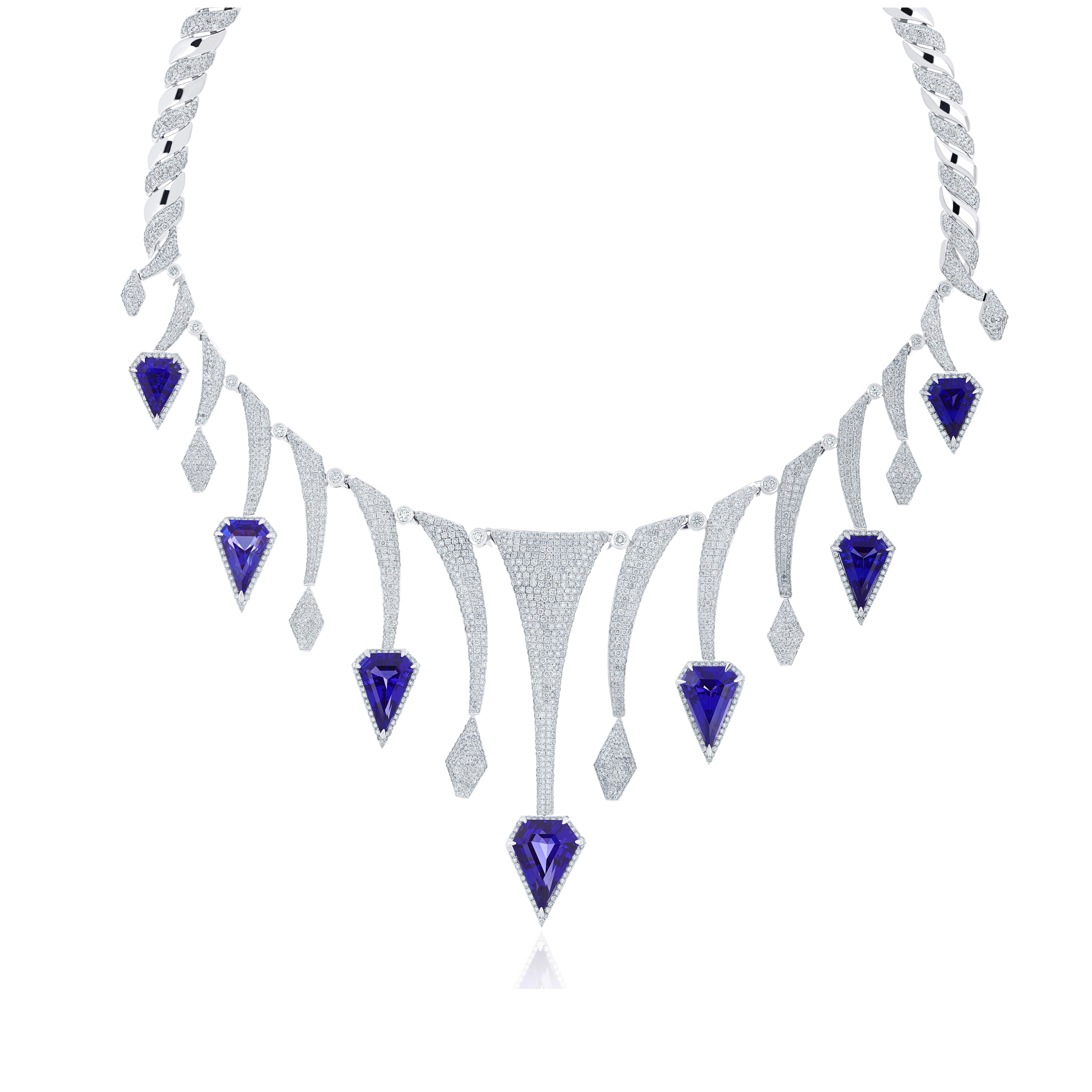 Elegant and Exquisitely detailed Gold Necklace, with 61.5Cts(approx.) Fancy Shape Tanzanite set in the center beautifully accented with Micro pave set Diamonds, weighing approx. 18.8 CT's (approx.). total carat weight to further enhance the beauty