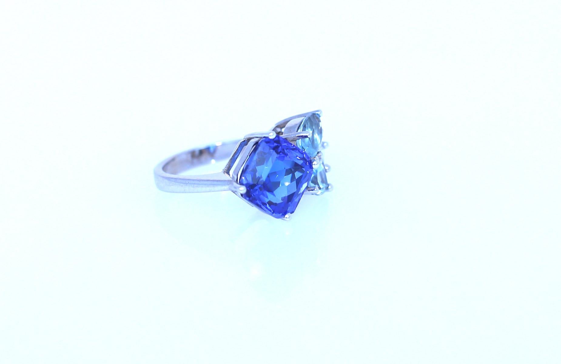 Tanzanite Diamond Ring 14K White Gold. Created in  2023.

6.8 Carats of fine Tanzanite and approximately 0.4 Carats of fine  Diamond. Superb design with amazing color grading from deep blue to light blue to clear white Diamonds. 
Stamped on the