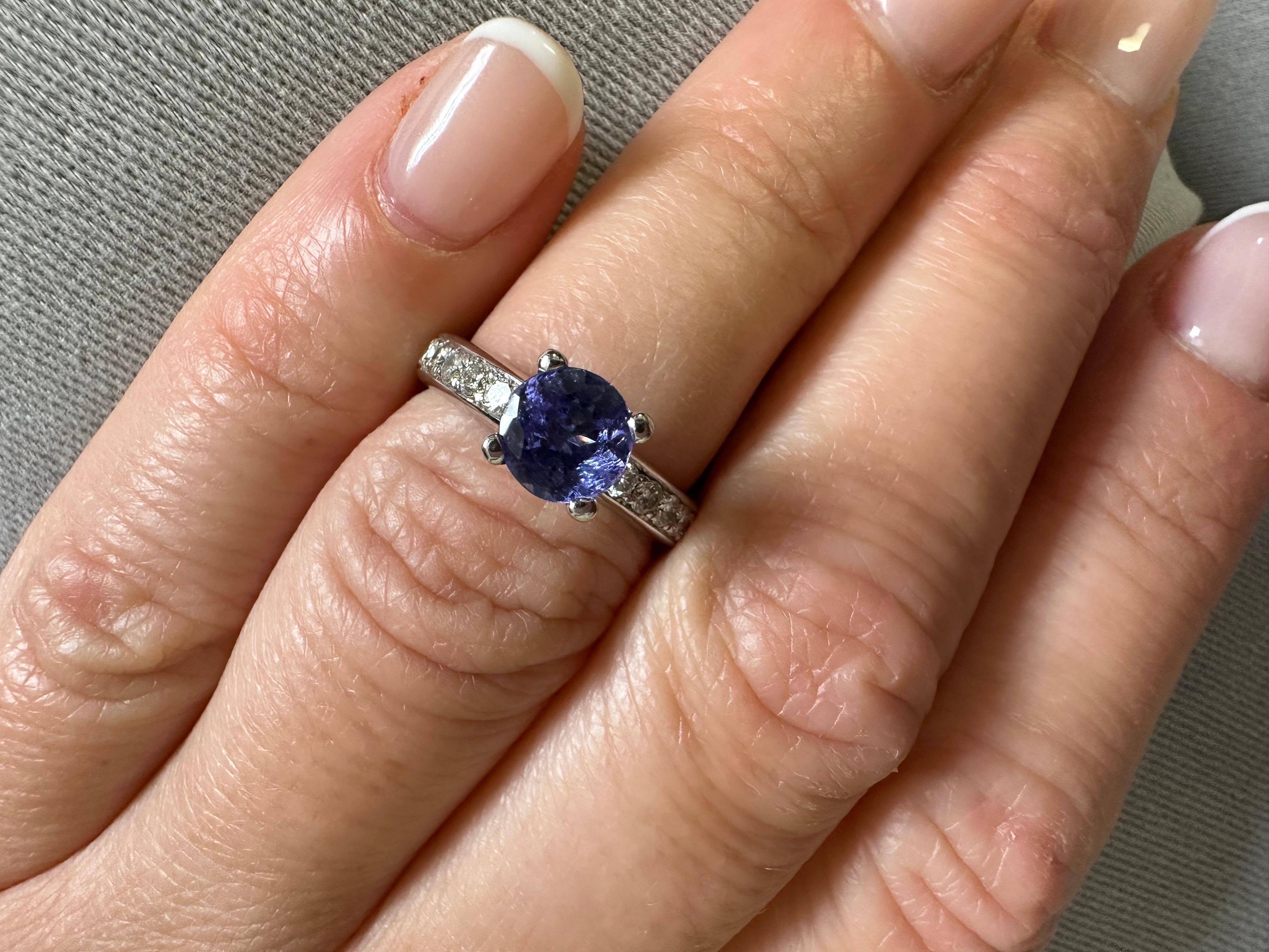 Stunning engagement ring made with 1ct tanzanite and natural diamonds in 14KT gold.

Metal Type: 14KT

Natural Tanzanite(s):
Color: Violet
Cut: Round
Carat: 1ct
Clarity: Moderately Included

Natural Diamond(s): 
Color: F-G-H
Cut:Round
