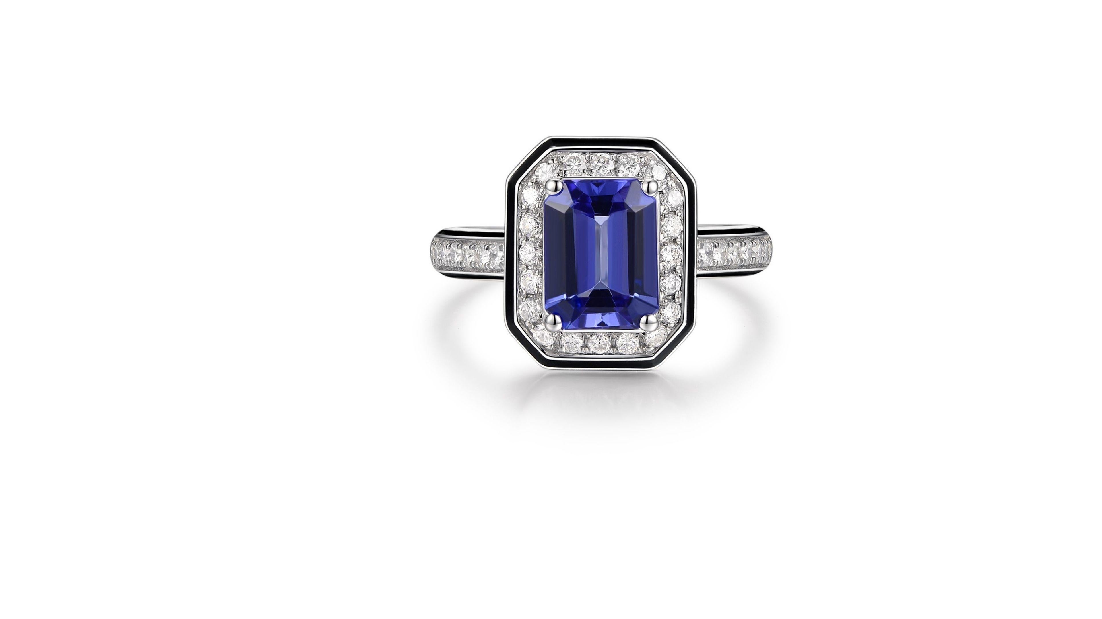 
This Tanzanite ring 1.4ct  stands out with the 34 diamonds in a unique design for a cushion cut. Set in 18k White Gold and if your looking for anything specific  in terms of design or ct etc let us know.

Tell us your size too

