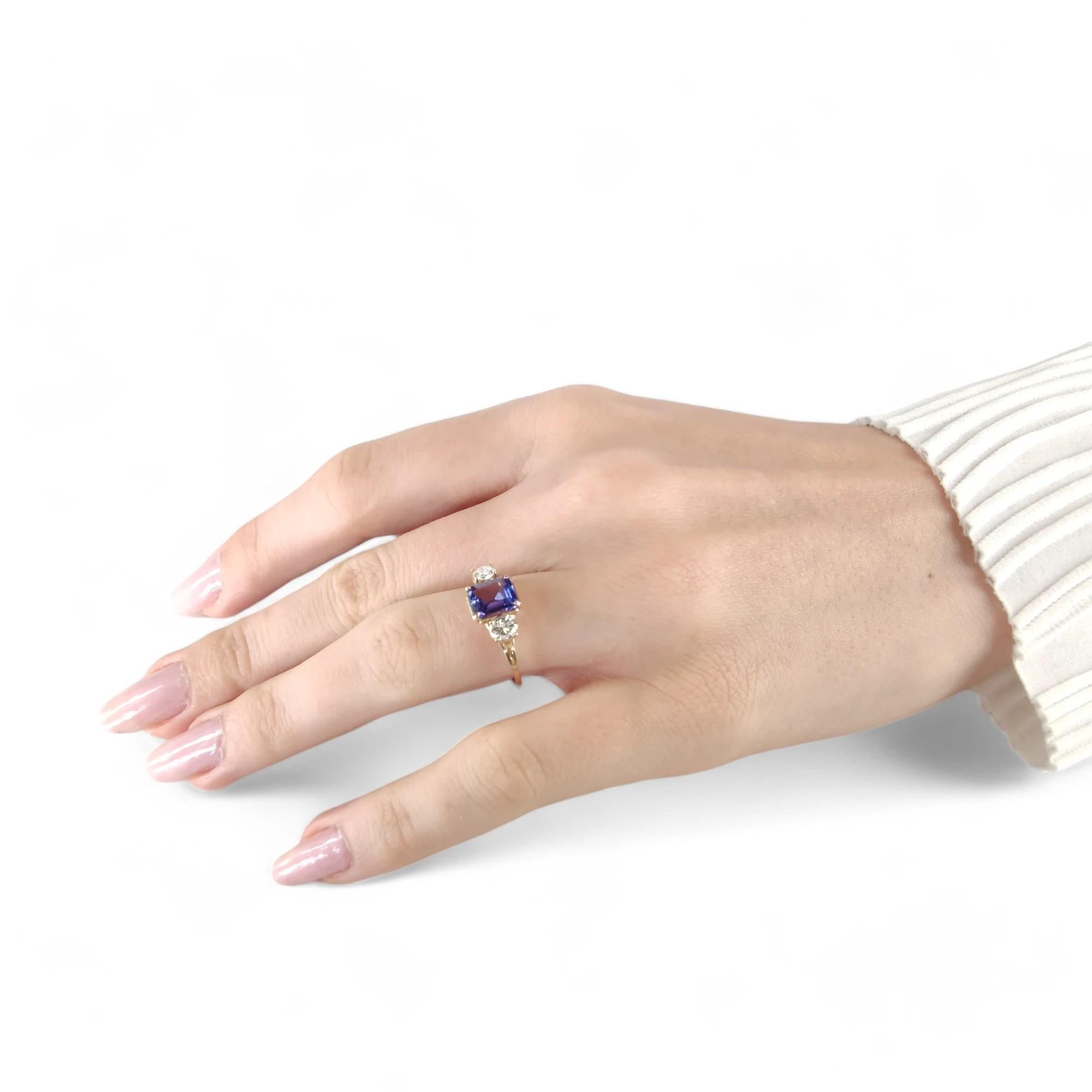 Discover this certified Tanzanite and Diamond ring, a handcrafted piece of jewelry in 14K gold. Perfect for women seeking a unique engagement ring or special gift. This handmade ring features an emerald-cut Tanzanite with natural diamonds, blending