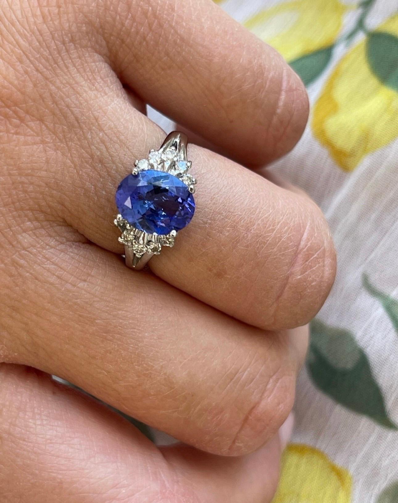 Such elegant tanzanite and diamond ring in 14KT white gold, the tanzanite is approximately 1.50 carats and diamonds are 0.30 carats, the ring is made with fine diamonds at VS clarity and G color and the tanzanite is a deep violet color 100% eye