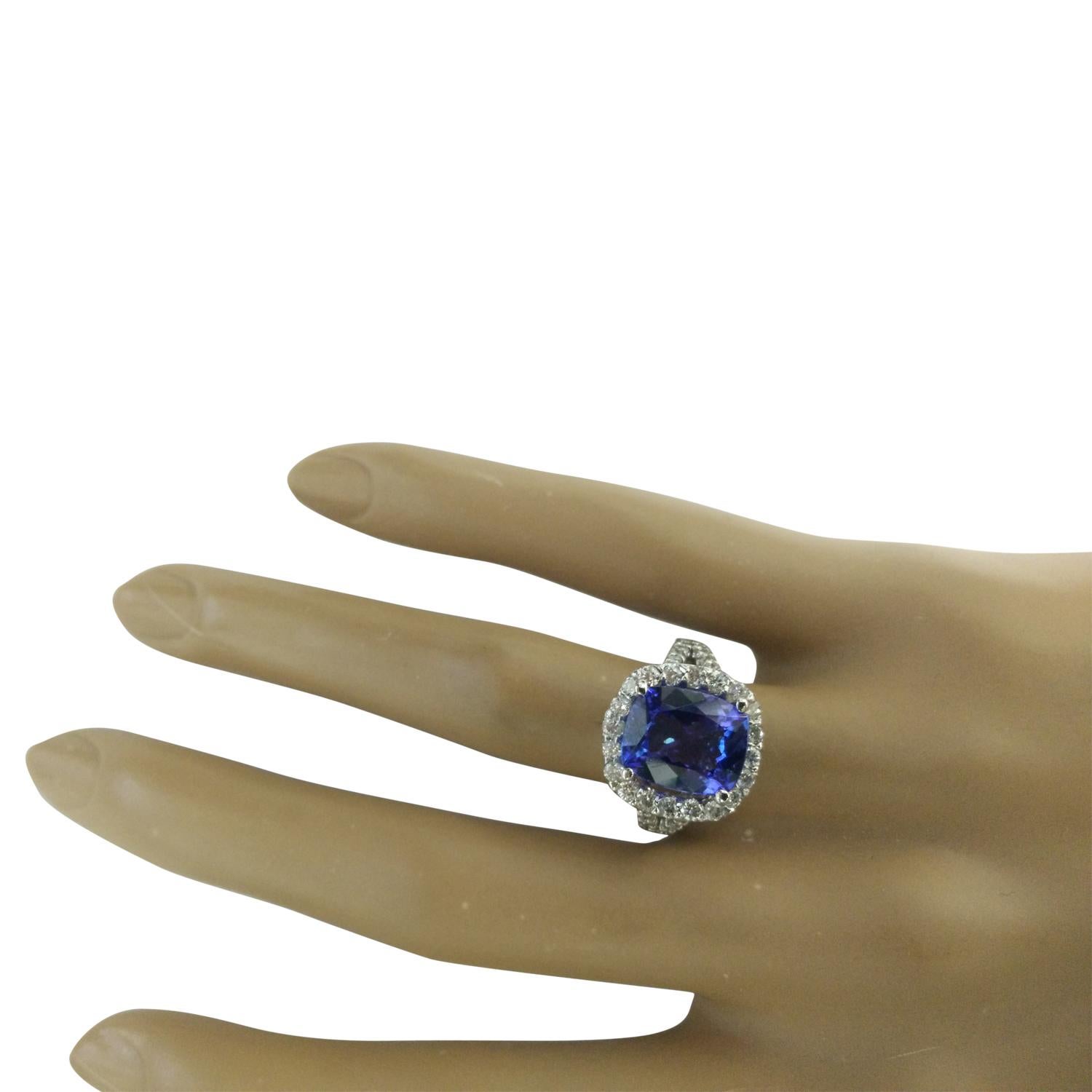 5.09 Carat Natural Tanzanite 14 Karat Solid White Gold Diamond Ring
Stamped: 14K 
Total Ring Weight: 5.8 Grams 
Tanzanite Weight: 4.00 Carat (11.00x9.00 Millimeters)  
Diamond Weight: 1.09 Carat (F-G Color, VS2-SI1 Clarity )
Quantity: 56
Face