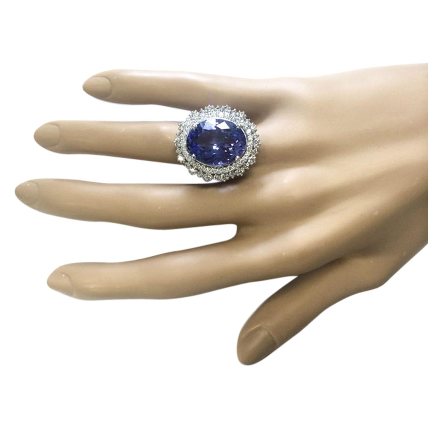 13.75 Carat Natural Tanzanite 14 Karat Solid White Gold Diamond Ring
Stamped: 14K 
Total Ring Weight: 9.7 Grams 
Tanzanite Weight: 11.75 Carat (16.00x12.00 Millimeters)  
Diamond Weight: 2.00 Carat (F-G Color, VS2-SI1 Clarity )
Face Measures: