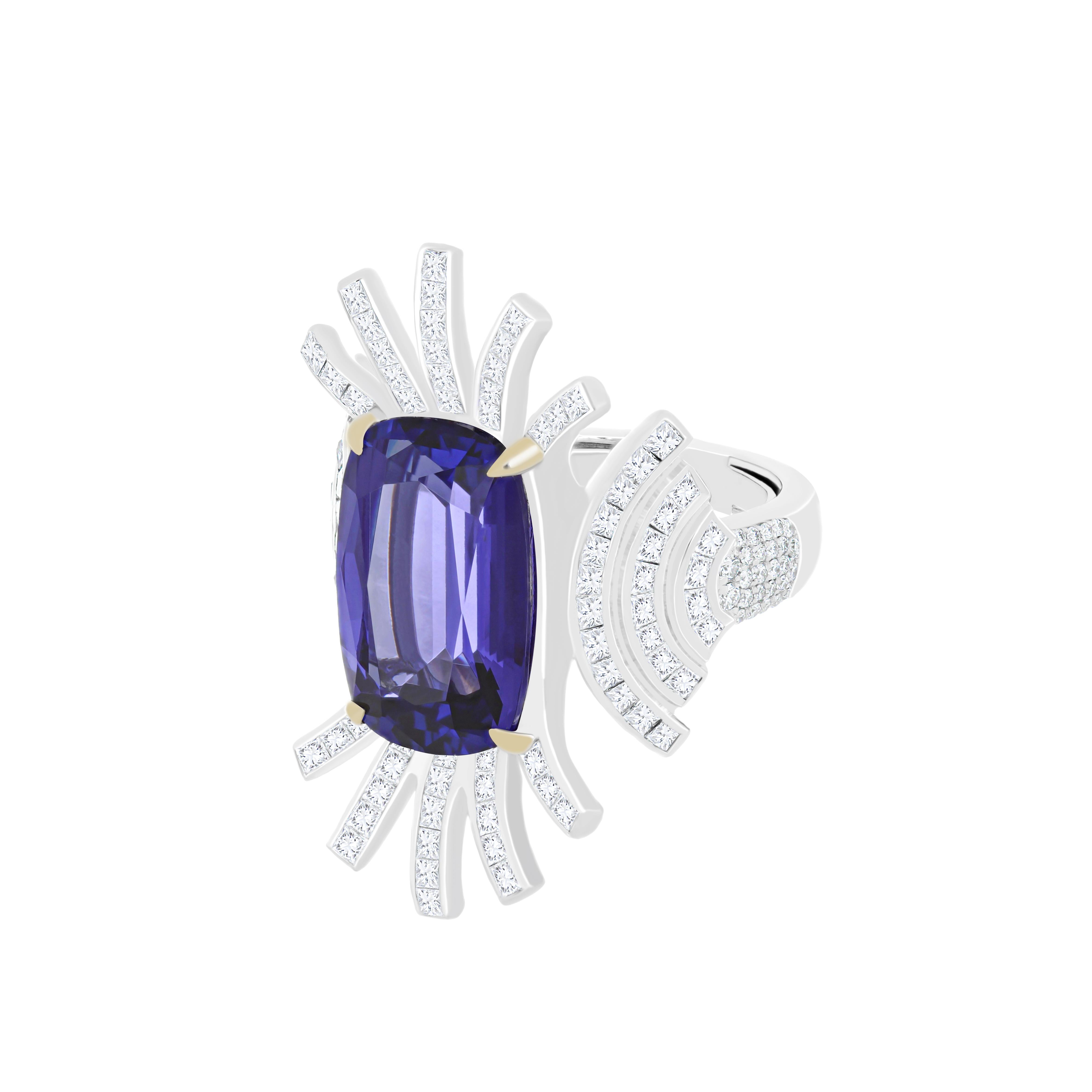 Elegant and Exquisitely detailed White Gold Ring, with a rare 10.4 Cts (approx.) Cushion Round Corner in faceted Cut Tanzanite set in the center beautifully accented with Micro pave set Diamonds, weighing approx. 2.7 CT's (approx.). total carats
