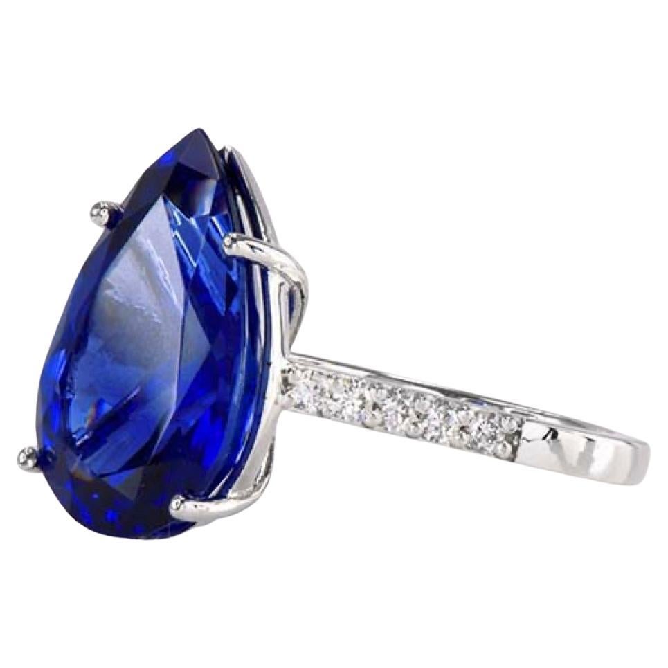 Tanzanite & Diamond Ring

Shape: Pear	

Gem Weight: 9.23	

Diamond Weight: 0.23
	
Gold: 18K White 

This virtually perfect blue 9.23 carat pear cut tanzanite, with .23 carat flawless diamond accents, is an exceptional example of the treasures that
