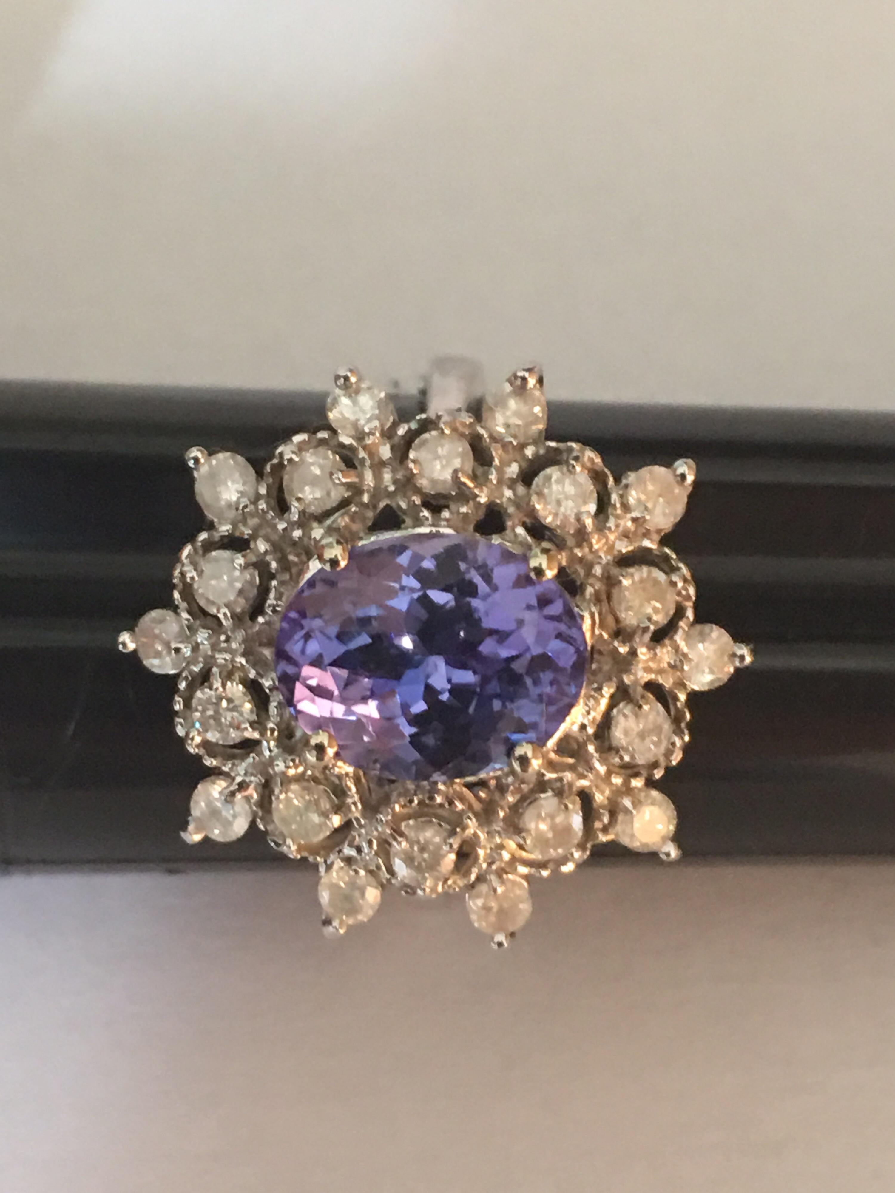 Natural 8mm X 10 mm tanzanite and .04 cents 20 diamonds is set in 14 Karat White gold is Hand crafted one of a kind ring.
Size of the ring is 8 1/4. If needed can be resized.
Quality of Tanzanite is AA and diamonds are SI3 .
Total stones is 3.17