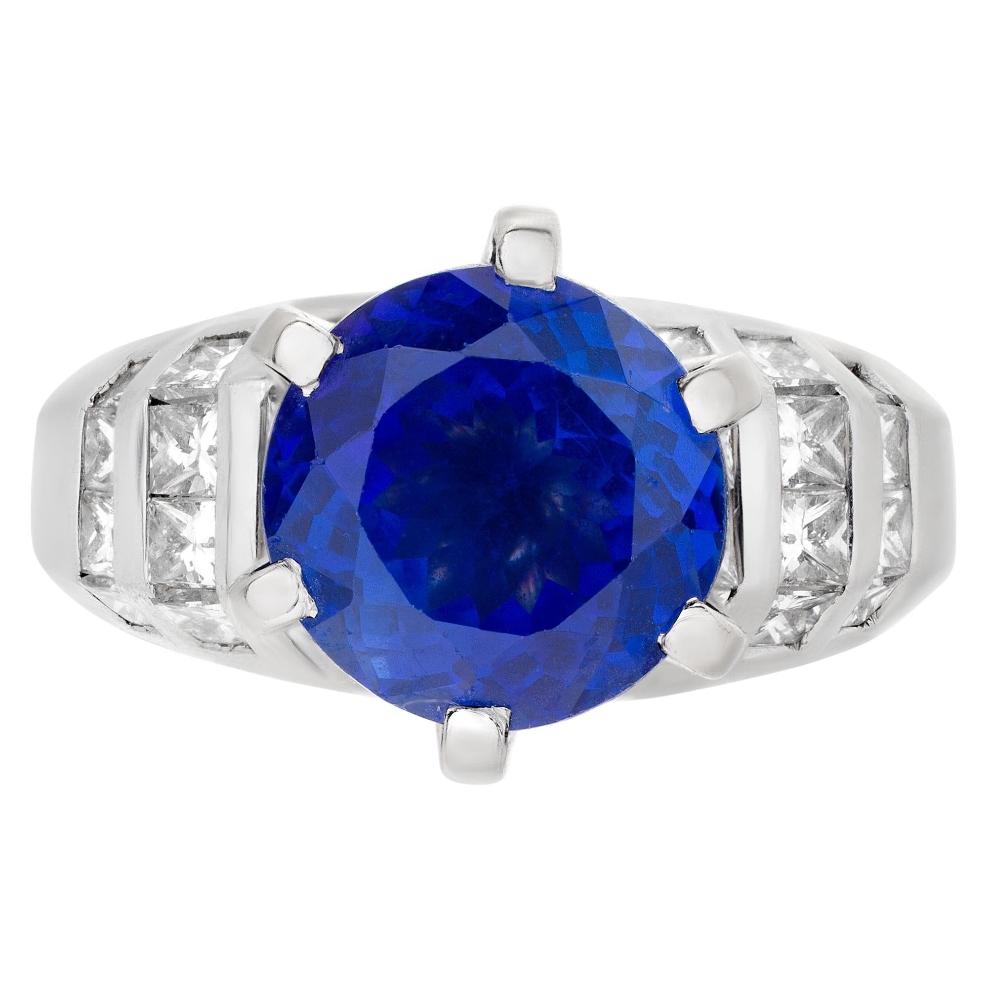 Elegante diamonds platinum ring with a 4 carat round cut center Tanzanite. Platinum setting has approx 1 carat Princess cut diamond. Tanzanite: 10mm diameter. Size 7

This tanzanite/diamond ring is currently size 7 and some items can be sized up or