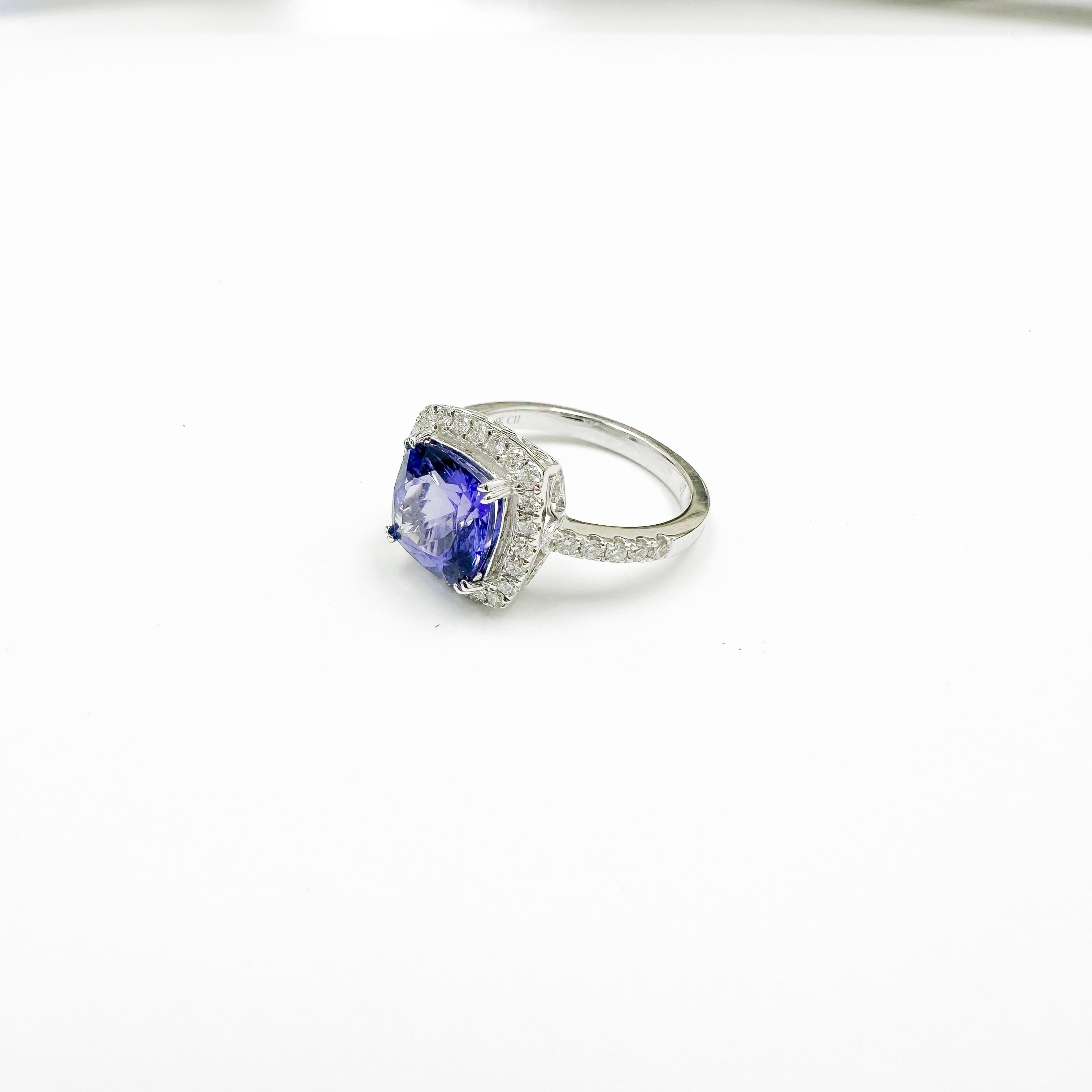 Glamorous Tanzanite Ring with bright Diamonds from all corners and sizes with a Cushion shape Tanzanite at its heart.

Secure Yours Today: Limited stock available. Don't miss the chance to secure your Tanzanite Diamond Ring today. It's not just a