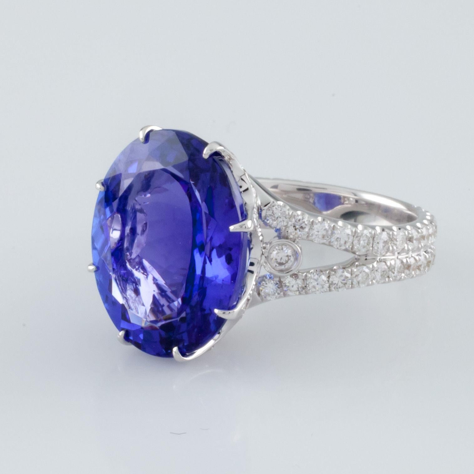 Gorgeous 18k White Gold Tanzanite Solitaire Ring
Features Diamond-Studded Prong and Double Band
Size 6.5
Includes Appraisal, Which Reads:
Diamonds:
Shape: Full cut
Quantity: 100, Mounted
Actual Weight = 1.43 carat
Average Clarity = VS2 - SI1
Average
