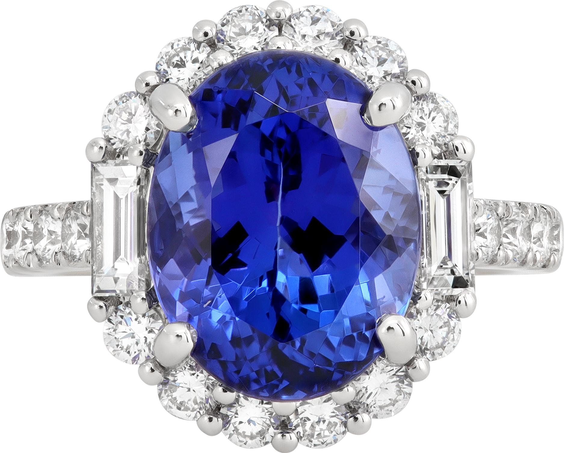 Tanzanite & diamond ring in 18k white gold with a center oval cut tanzanite (6.25 carats) accented with approximately 1.35 carats of round and baguette diamonds averaging G-H color, VS clarity. Size 6 1/2.

This tanzanite/diamond ring is currently