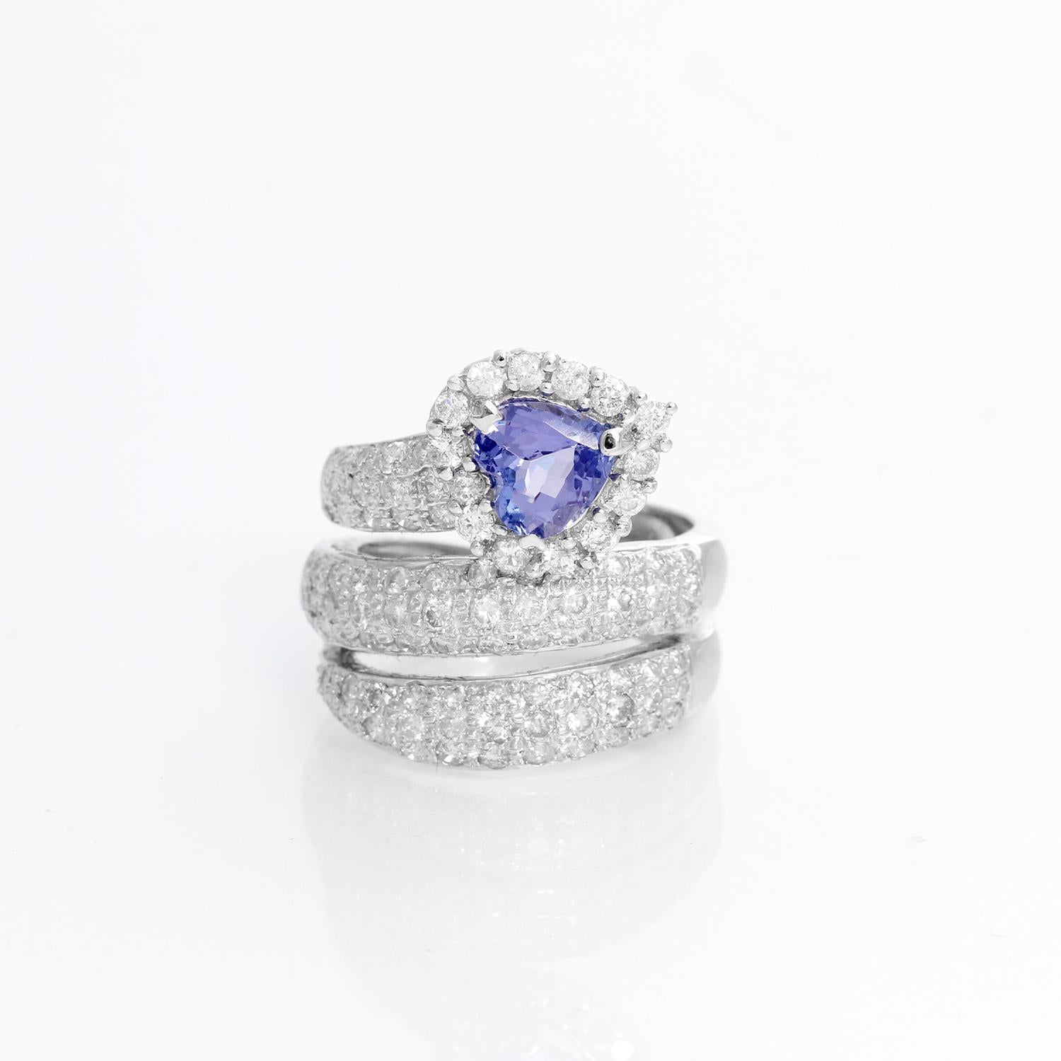 Tanzanite & Diamond White Gold Ring Size 6 - A serpentine design with round brilliant cut diamonds weighing approximately weighing 2 cts. Set in 14K White Gold with a heart shaped blue Tanzanite. Size 6 .