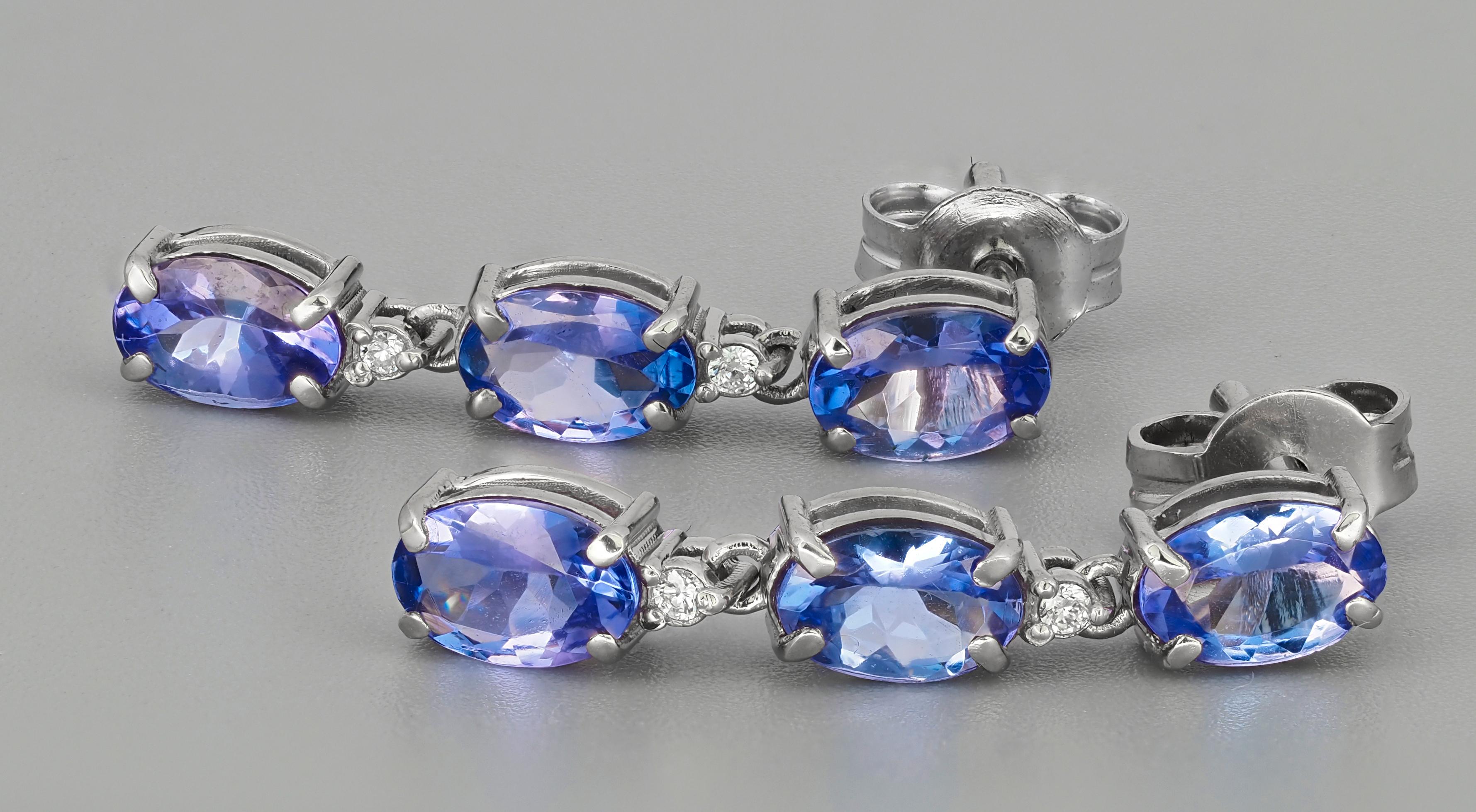 Modern Tanzanite, diamonds 14k gold earrings studs For Sale