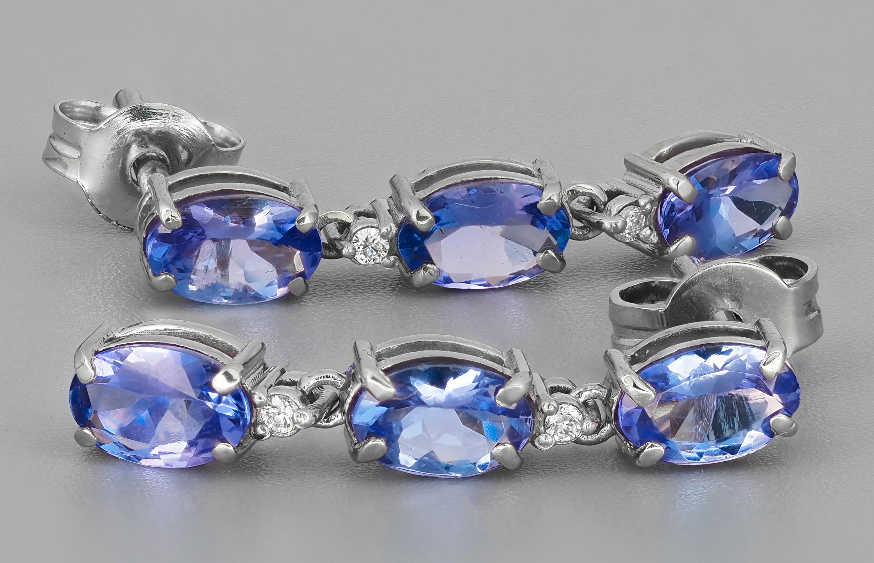 Oval Cut Tanzanite, diamonds 14k gold earrings studs For Sale