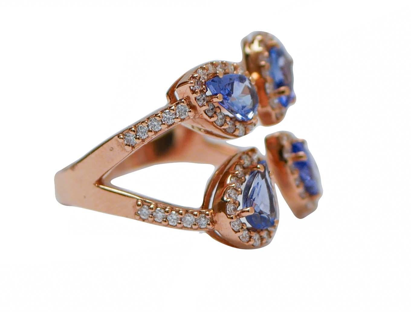 Amazing modern ring in 18 kt rose gold structure mounted with four drop tanzanite surrounded by diamonds.
Diamonds 0.72 ct
Tanzanite 1.57 ct
Total Weight 5.30 gr
RF       G     FFIF
RK.AHEC
Italian Size 14.5
Usa Size 7
French Size 54.5

For any