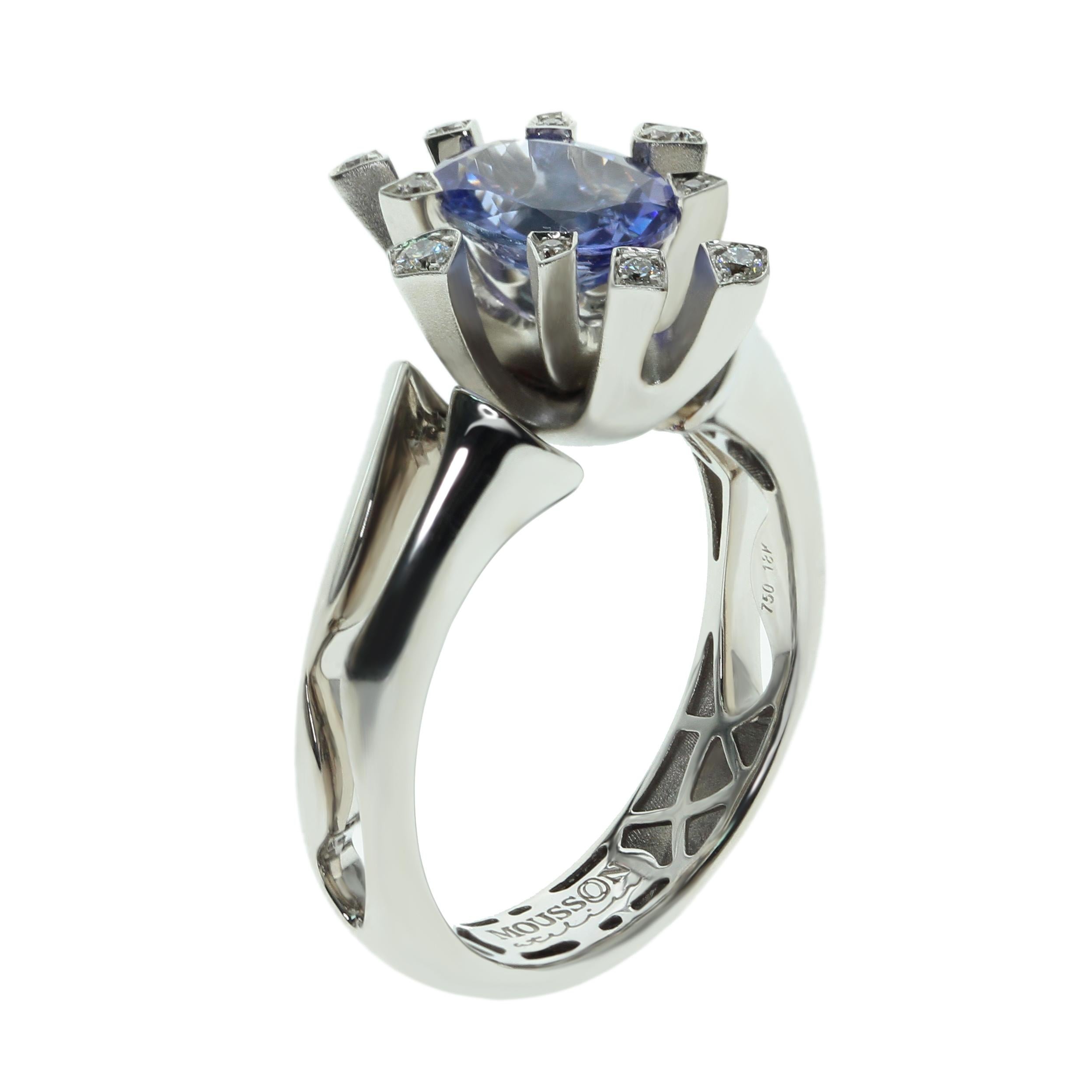 Tanzanite Diamonds 18 Karat White Gold Snowflake Ring
Why snowflake? Look at the unique Ring design, reminiscent of the cold beauty of winter. Shank of Ring is made in glossy 18K White Gold, it seems to have cracked on its sides, which express the