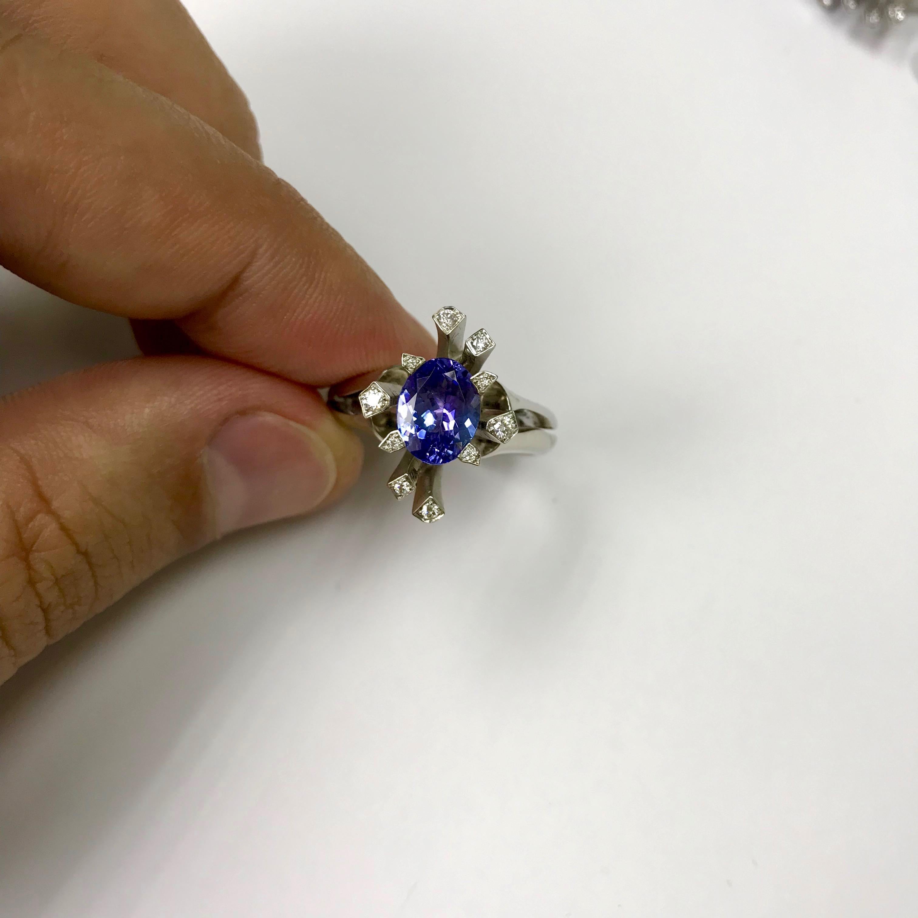 Oval Cut Tanzanite Diamonds 18 Karat White Gold Snowflake Ring For Sale