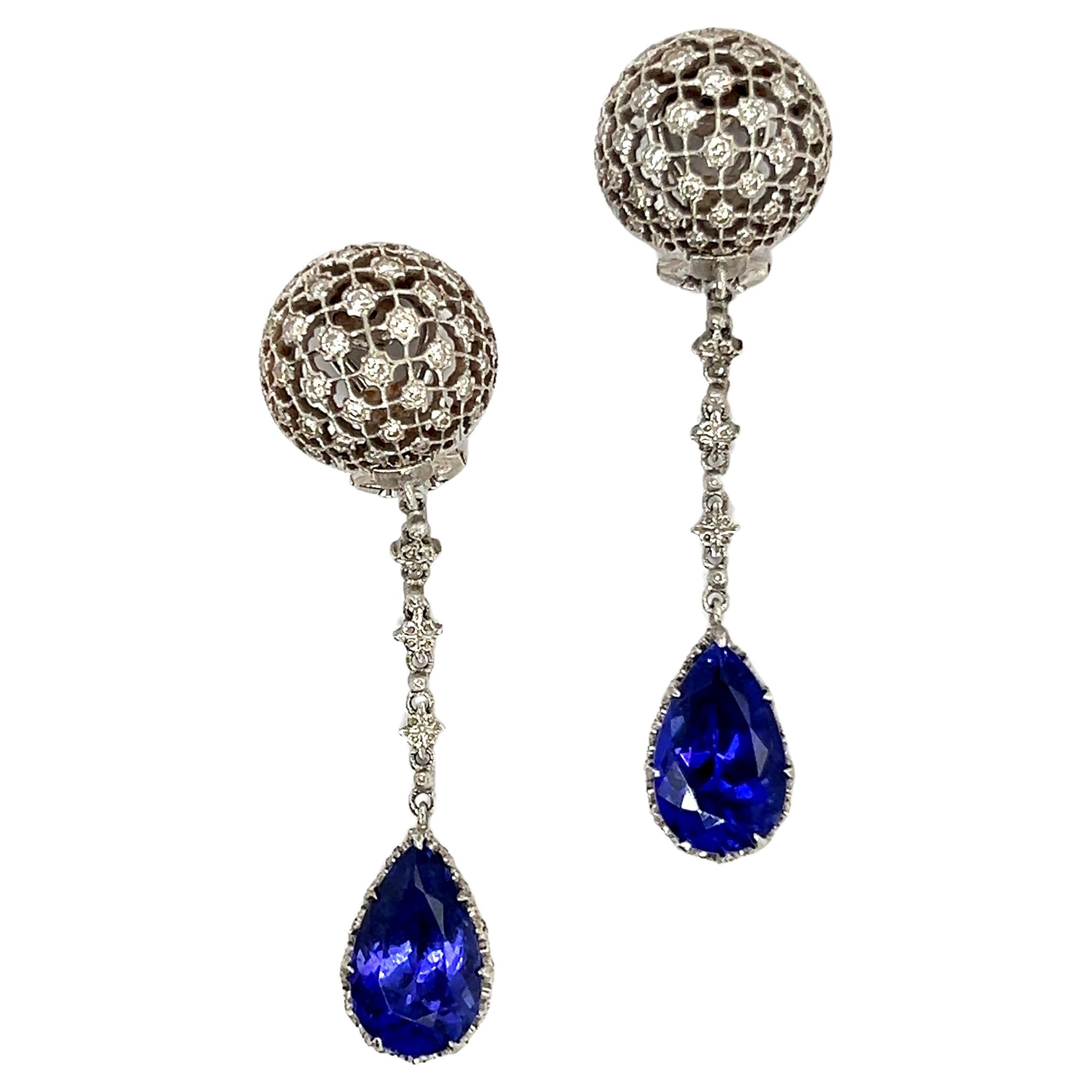 Experience the captivating elegance of Buccellati's extraordinary Tanzanite Earrings with Diamonds, crafted in 18 Karat white gold. Impeccable craftsmanship and meticulous attention to detail define these exquisite earrings. Delicate lace-like