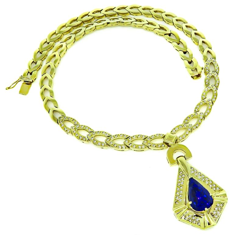 This gorgeous 14k yellow gold necklace is set with a lovely pear shape tanzanite that weighs approximately 7.98ct. Accentuating the tanzanite are sparkling round cut diamonds that weigh approximately 2.00ct. graded I color with VS2 clarity. The