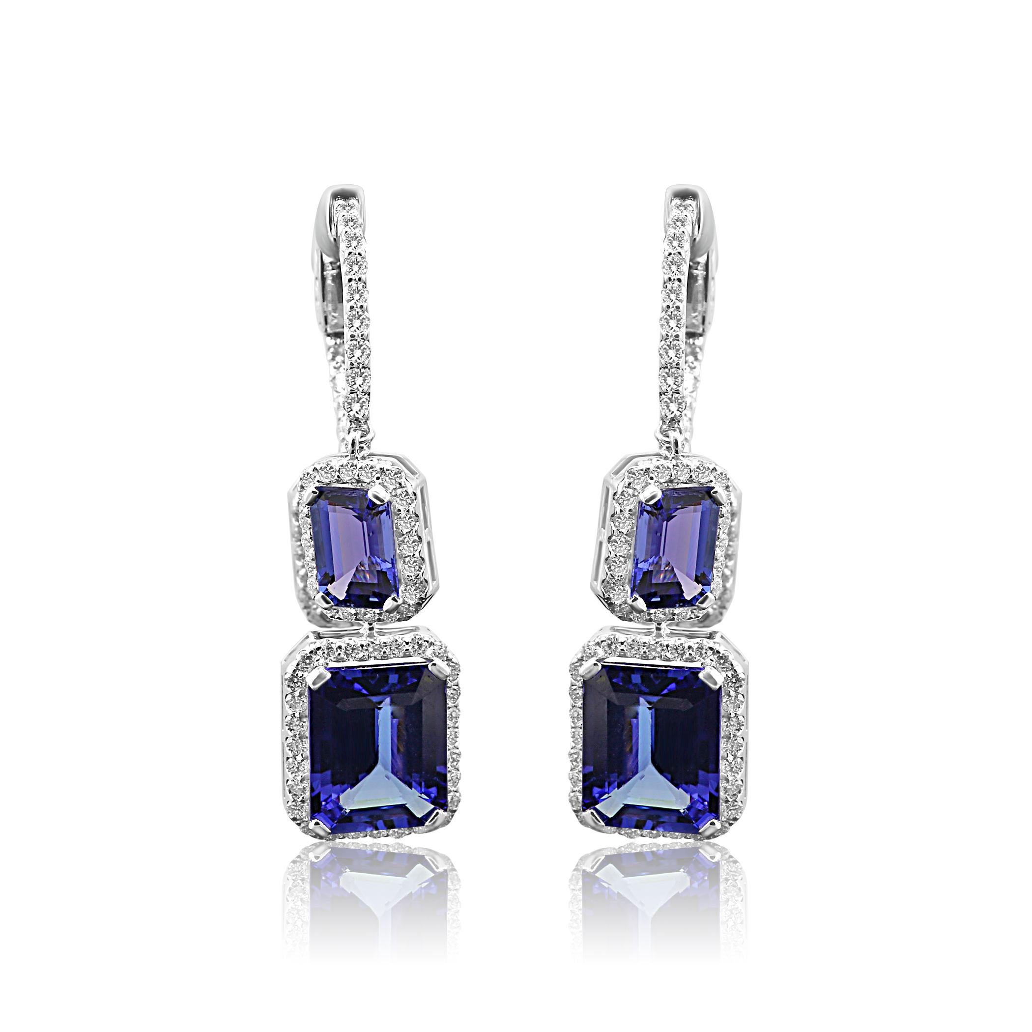 Stunning 2 Emerald cut Tanzanites 6.15 Carat with 4 smaller Tanazanites 4.47 Carat set in Halo White G-H color VS-SI Diamond Rounds 1.65 Carat set in Gorgeous Halo style Dangle Drop Earring in 14K White Gold.

Style available in different price