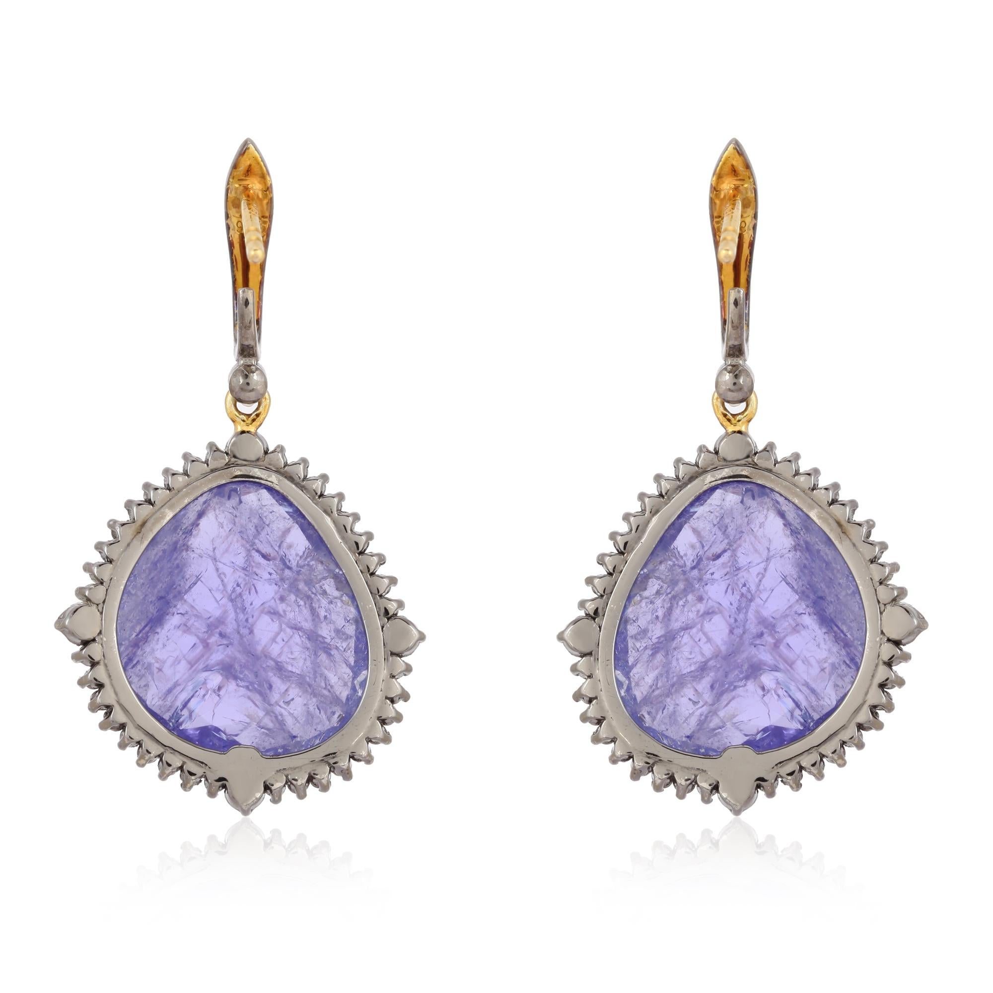 Cast in 18-karat gold & sterling silver, these stunning drop earrings are set with 18.05 carats tanzanite, .30 carats Emerald and .69 carats of sparkling diamonds. 

FOLLOW  MEGHNA JEWELS storefront to view the latest collection & exclusive pieces. 