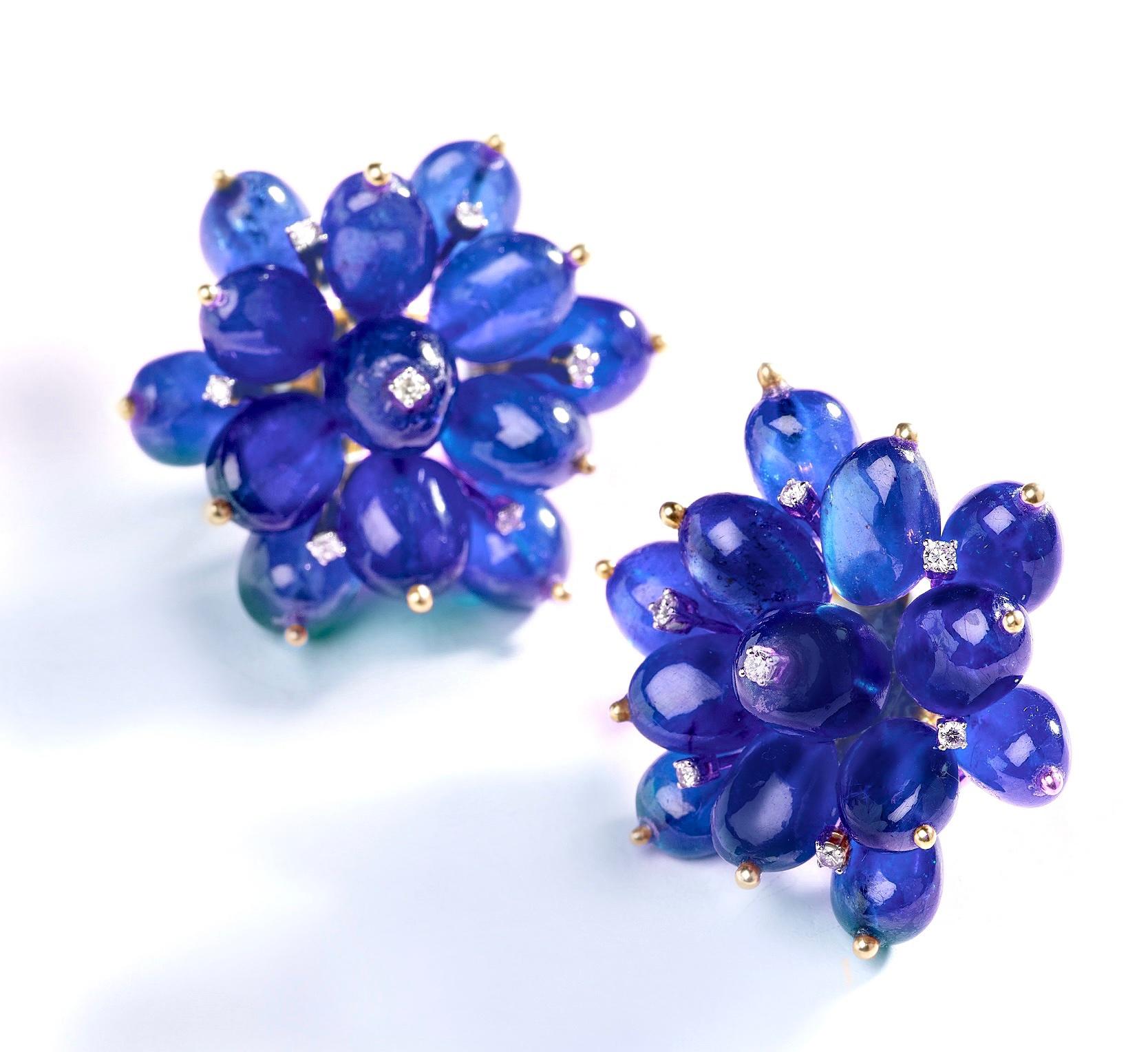 “Tanzanite Flower Earrings“

Push-back earrings crafted in 14kt Yellow Gold and set with 80 carats of Rubies and 0.30 carats of brilliant-cut round diamonds. 