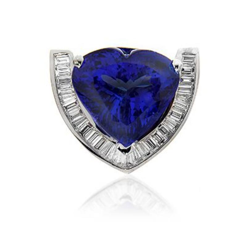 TANZANITE HEART PENDANT
A rich and glowing heart shape Tanzanite is cradled by a striking
channel of baguettes.
Item: # 01603
Metal: 18k W
Color Weight: 25.33 ct.
Diamond Weight: 1.90 ct