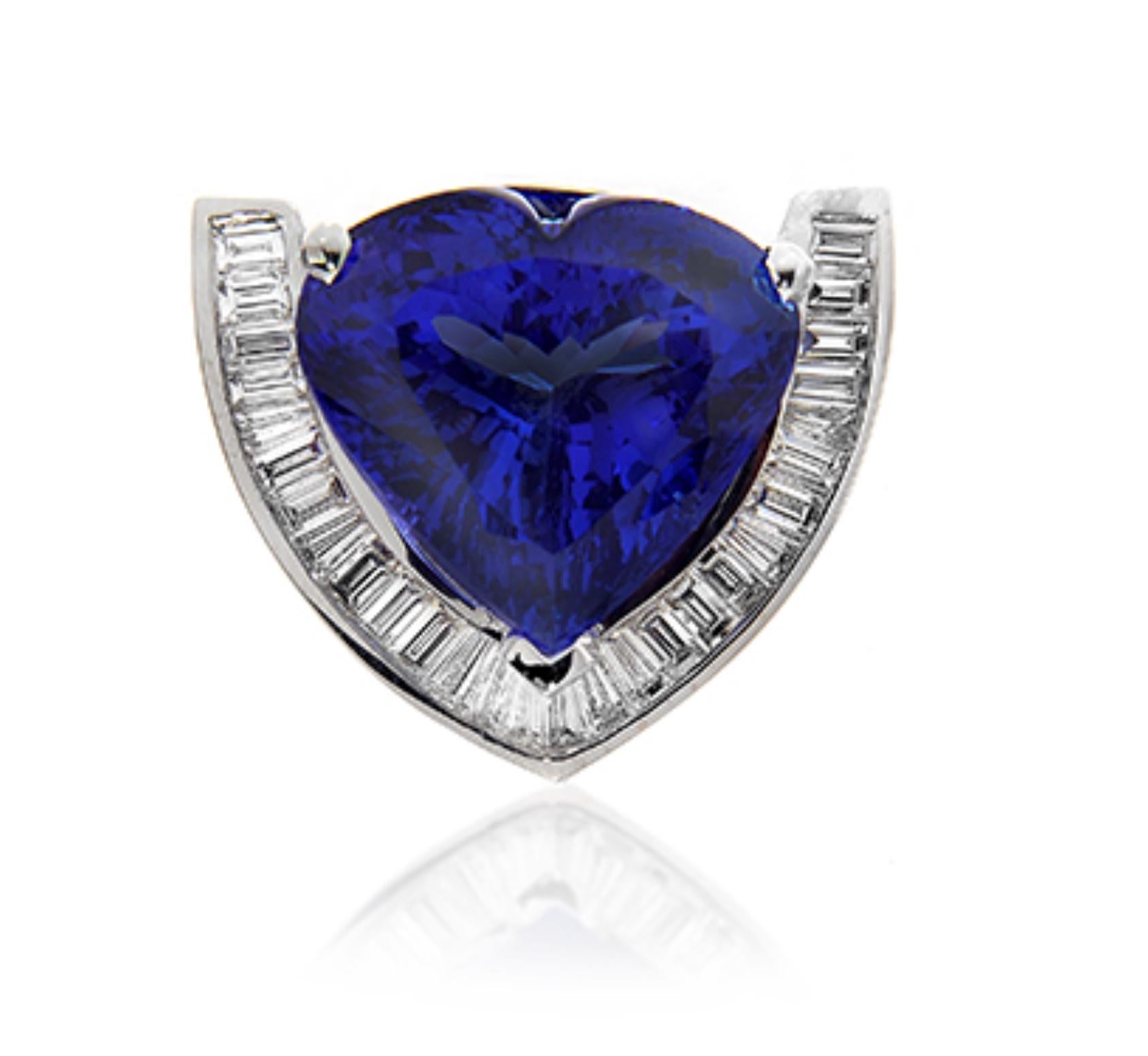 TANZANITE HEART PENDANT
A rich and glowing heart shape Tanzanite is cradled by a striking channel of baguettes.
Item:	# 01603
Metal:	18k W
Color Weight:	25.33 ct.
Diamond Weight:	1.90 ct.

