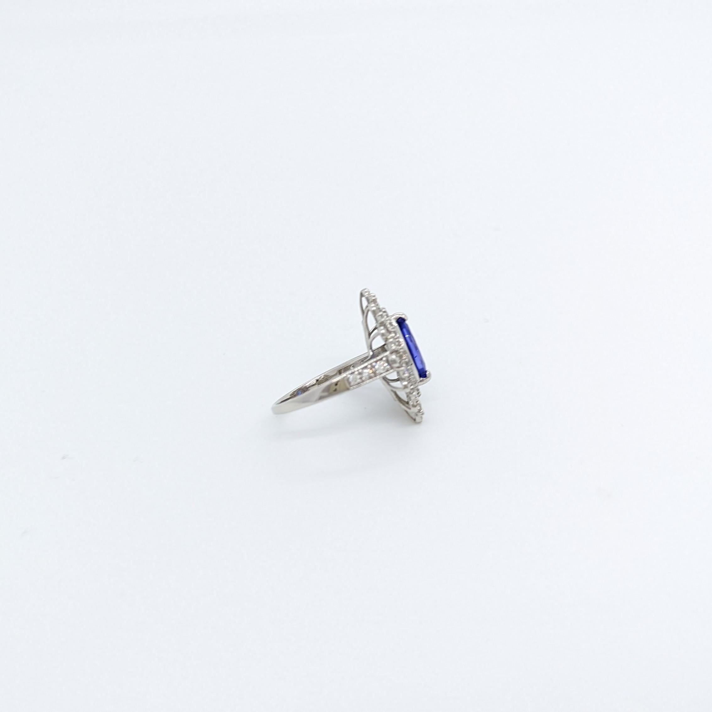 Women's or Men's Tanzanite Marquise and White Diamond Round Cocktail Ring in Platinum For Sale