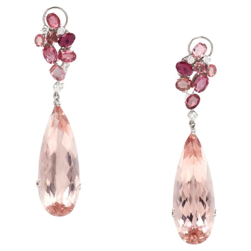 Ring

18K White Gold (Matching Earrings Available)

Weight 2,97 GMS 

Tanzanite -8/0.32 Ct

Morganite 2/48 cts

Moonstone -1/4.01 Cts

Pink Tourmaline -6/1.25 Cts
Size-51

Indulge in the enchanting allure of our Floral Collection with this exquisite