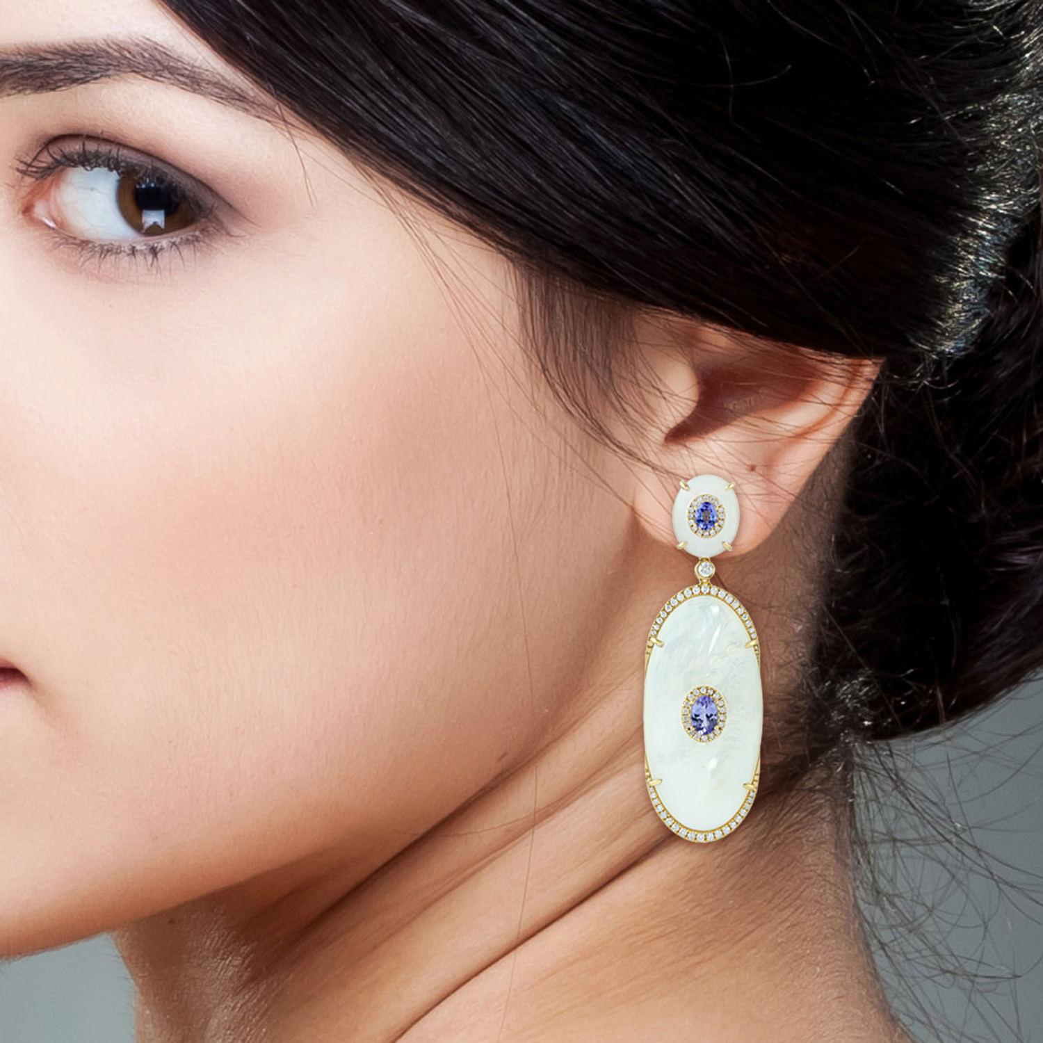Handcrafted entirely from 18-karat gold, these stunning earrings are set with 2.55 carats tanzanite, 48.28 carats mother of pearl and 1.41 carats of glimmering diamonds. 

FOLLOW  MEGHNA JEWELS storefront to view the latest collection & exclusive
