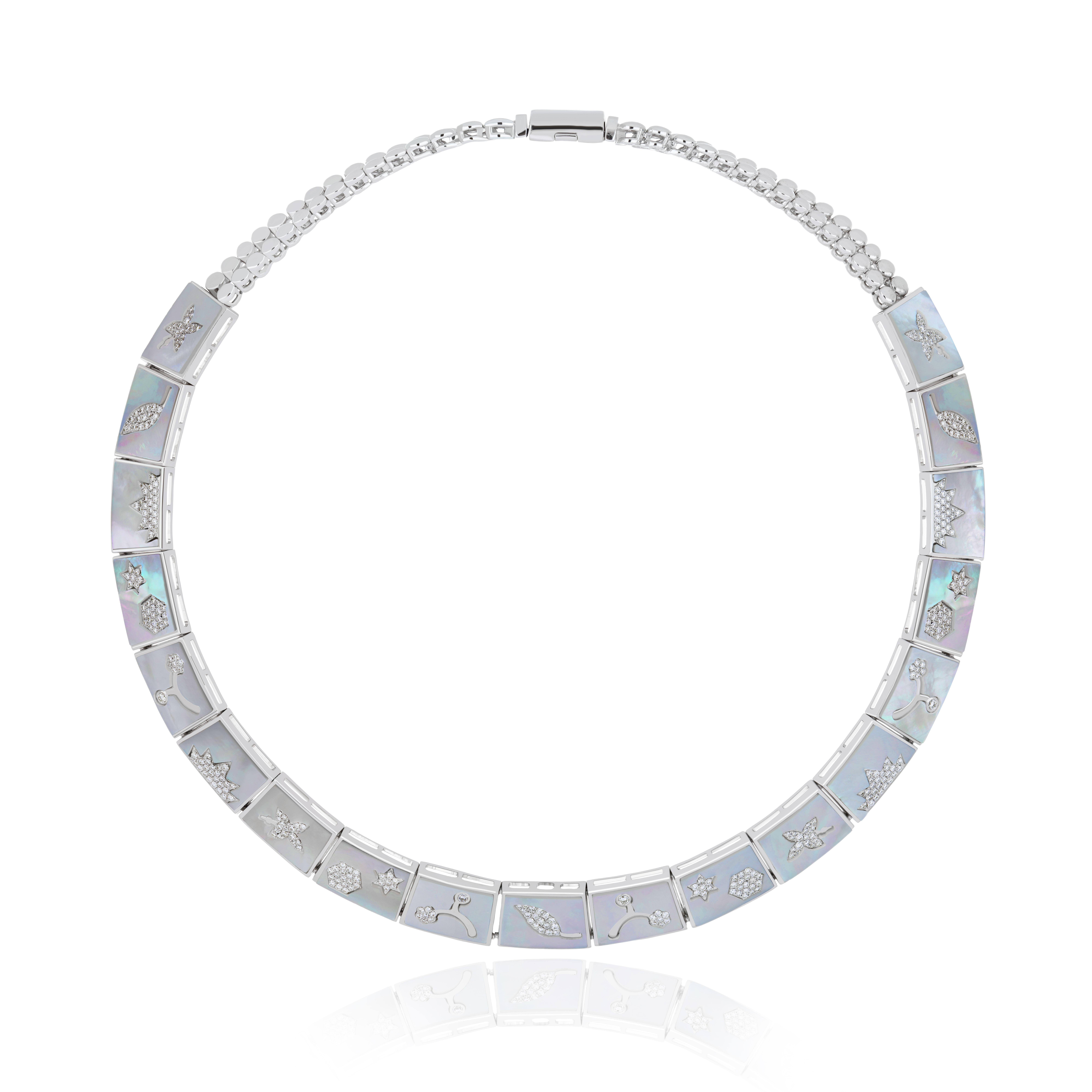 Elegant and Exquisitely detailed Gold Necklace, with 24.5 Cts (approx. total) Fancy Shape Tanzanite set in the center beautifully accented with Micro pave set Diamonds, weighing approx.9.8 CT's (approx. total). set in between  Mother of Pearl plates