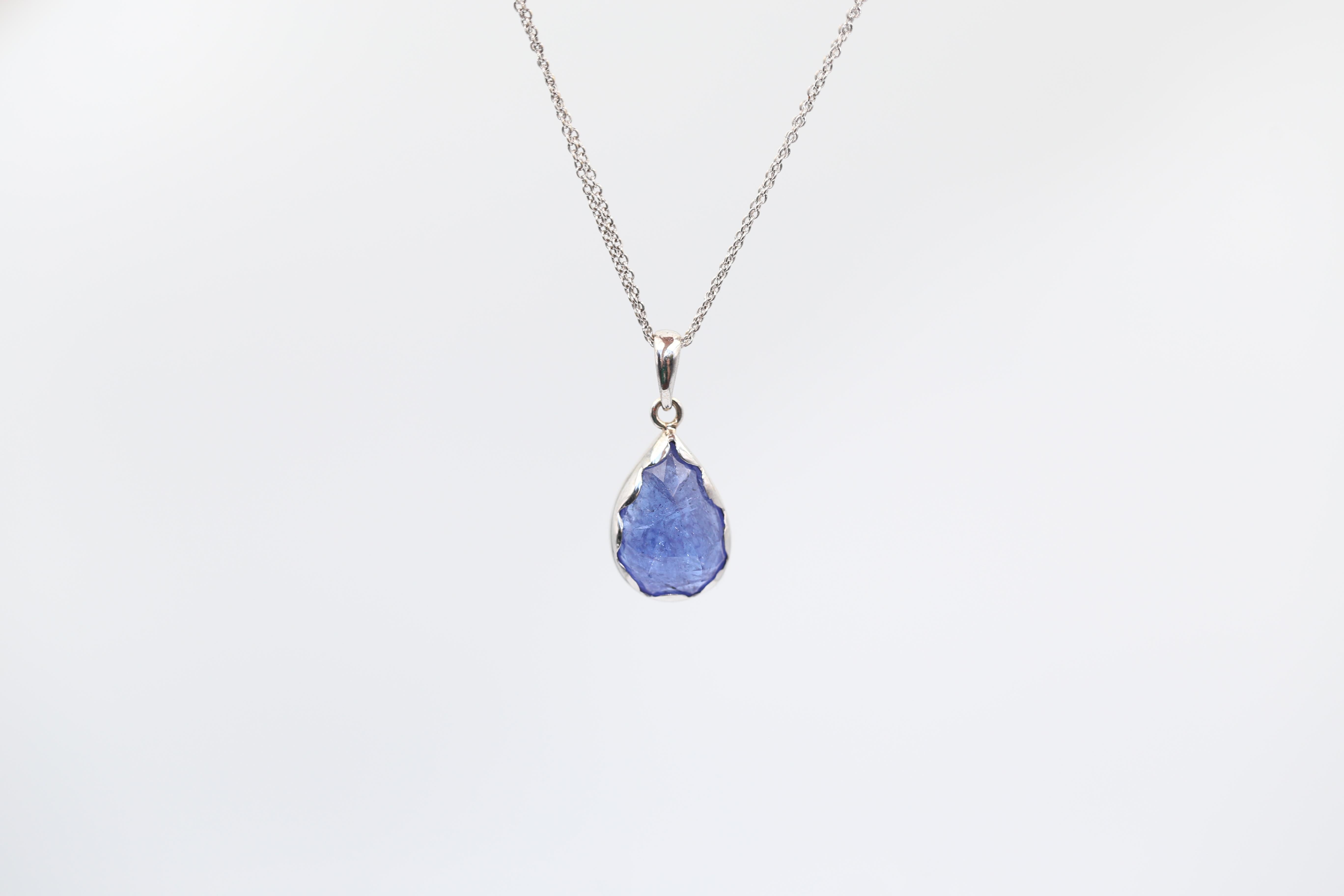 Tanzanite Natural Pendant White Gold Chain Italy, 2020

A natural Tanzanite pear-shaped stone is set in a White Gold Cast.

The stone is not transparent but it has a marvellous natural structure and inclusions that reflect light. As if many million
