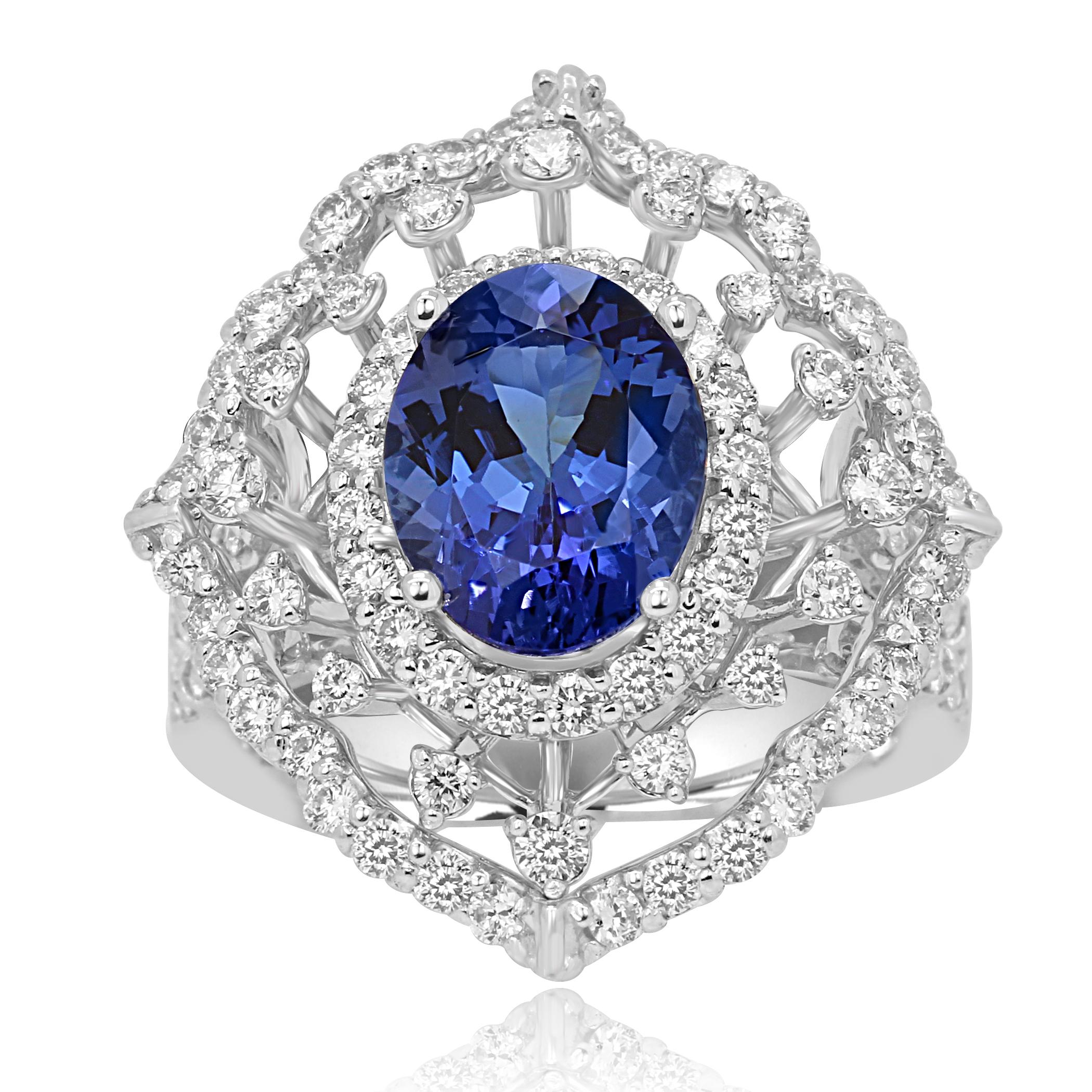 Tanzanite Cushion 2.75 Carat  encircled in a Triple Halo of White Round Diamonds 1.19 Carat in a Stunning 14K White Gold Cocktail Fashion Ring with nice wire work gallery ans split shank .

Style available in different price ranges. Prices are based