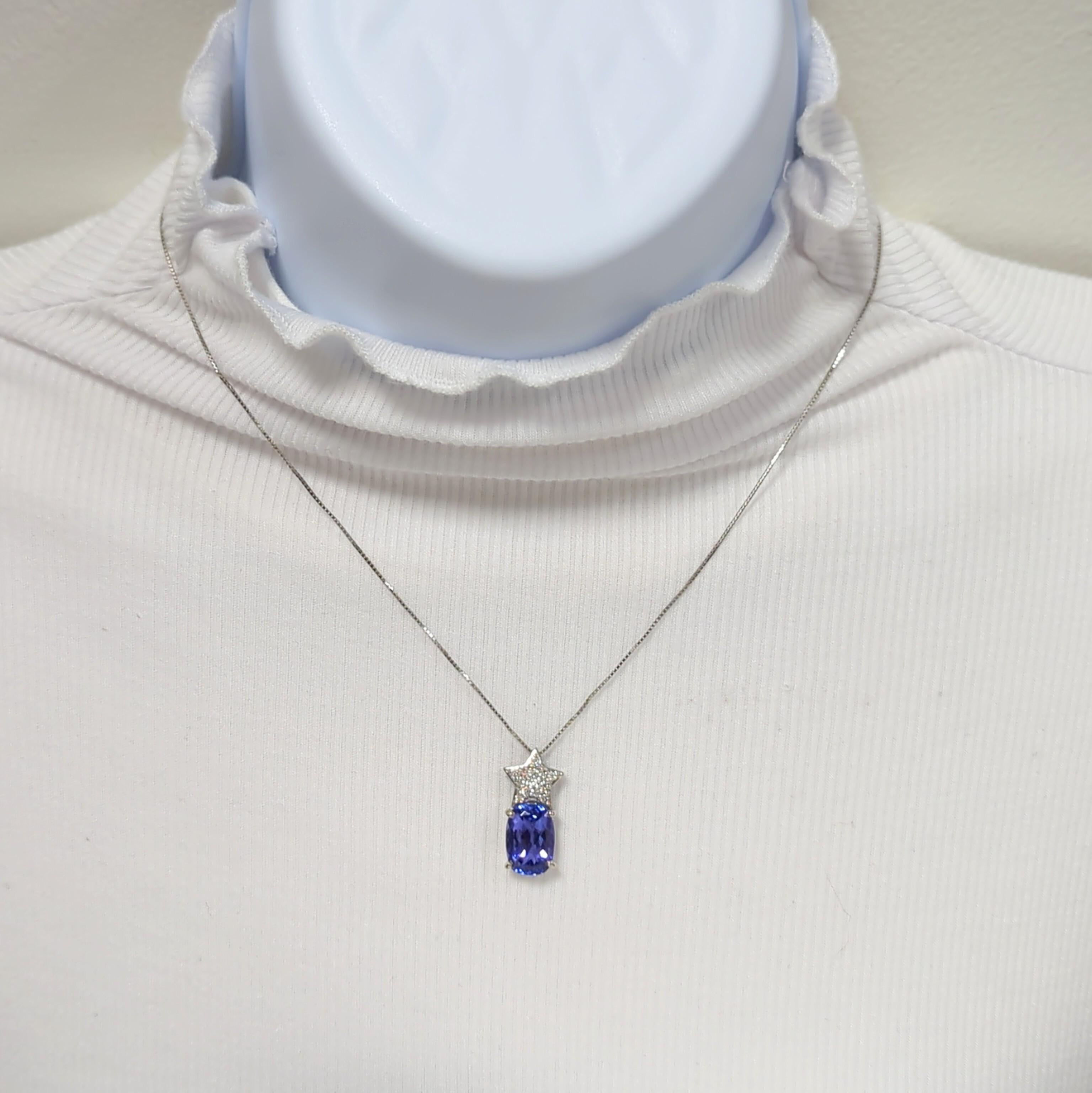 Gorgeous deep color tanzanite oval weighing 5.45 ct. with 0.25 ct. pave white diamonds.  Handmade platinum mounting.  Length is 19