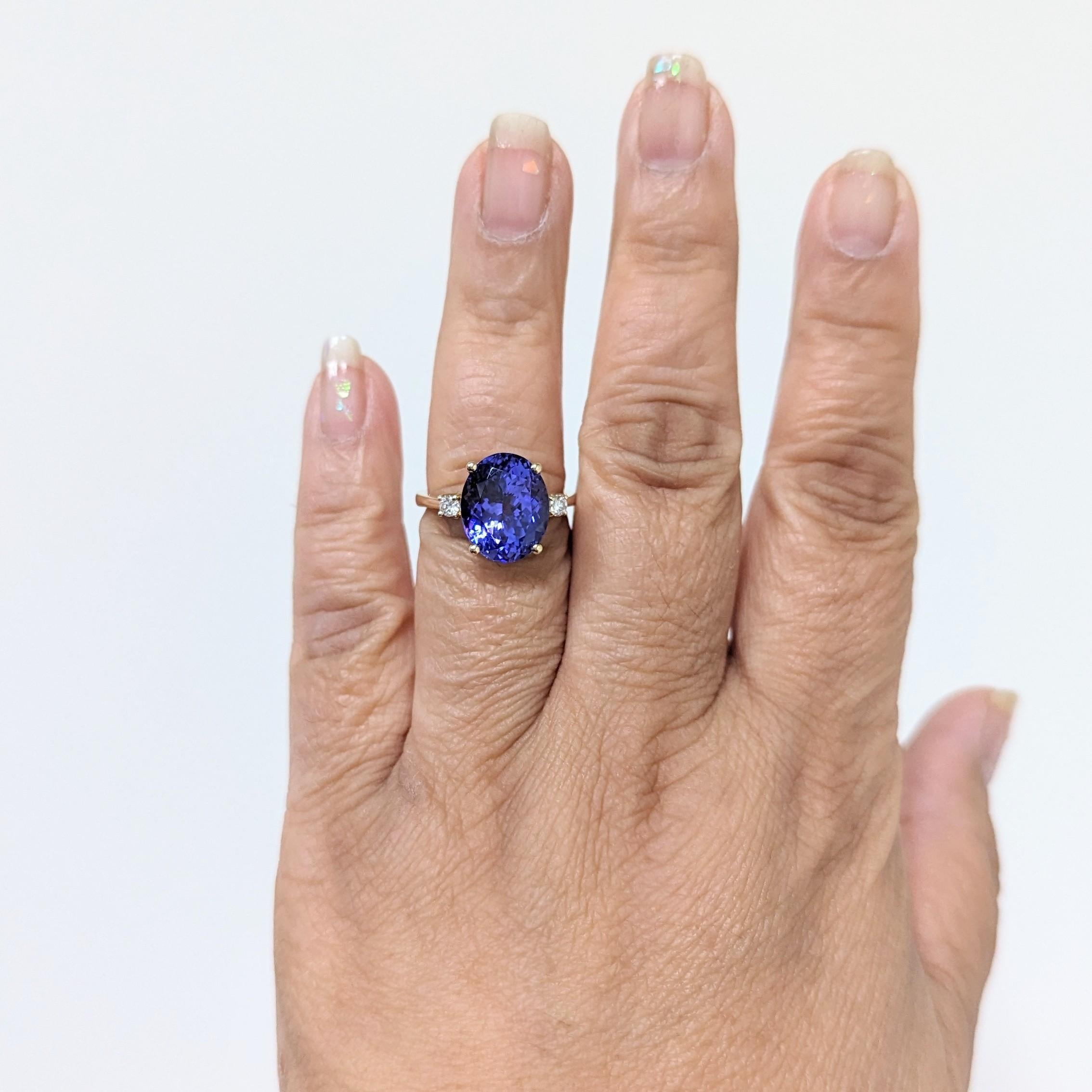 Beautiful 8.02 ct. tanzanite oval with 0.05 ct. good quality white diamond rounds.  Handmade in 14k yellow gold.  Ring size 7.25.
