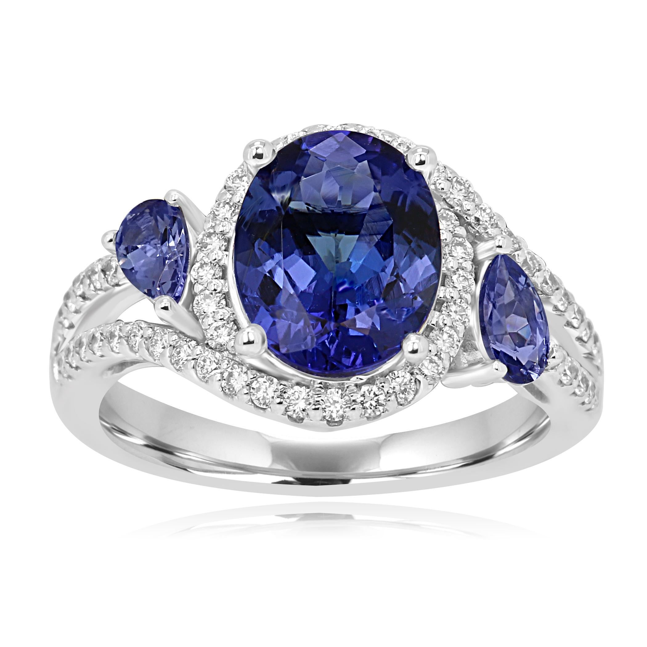 Gorgeous Tanzanite Oval 2.54 Carat Encircled in a Halo of White Diamond Round 0.38 Carat Flanked with 2 Tanzanite Pear on the side 0.46 Carat.

Style available in different price ranges. Prices are based on your selection of 4C's Cut, Color, Carat,