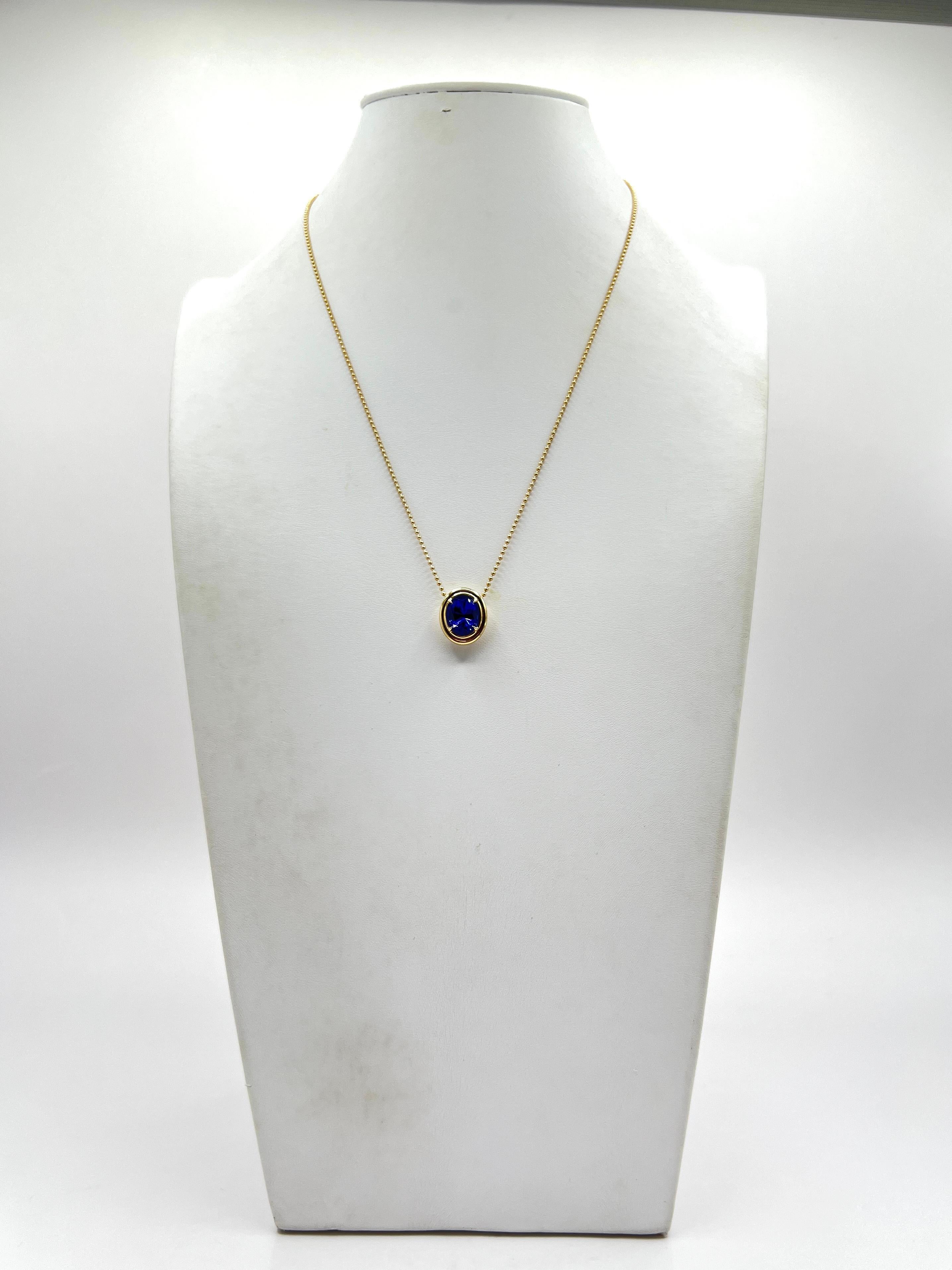 Beautiful 4.91 ct. tanzanite oval.  Handmade in 18k yellow gold.  Length is 18