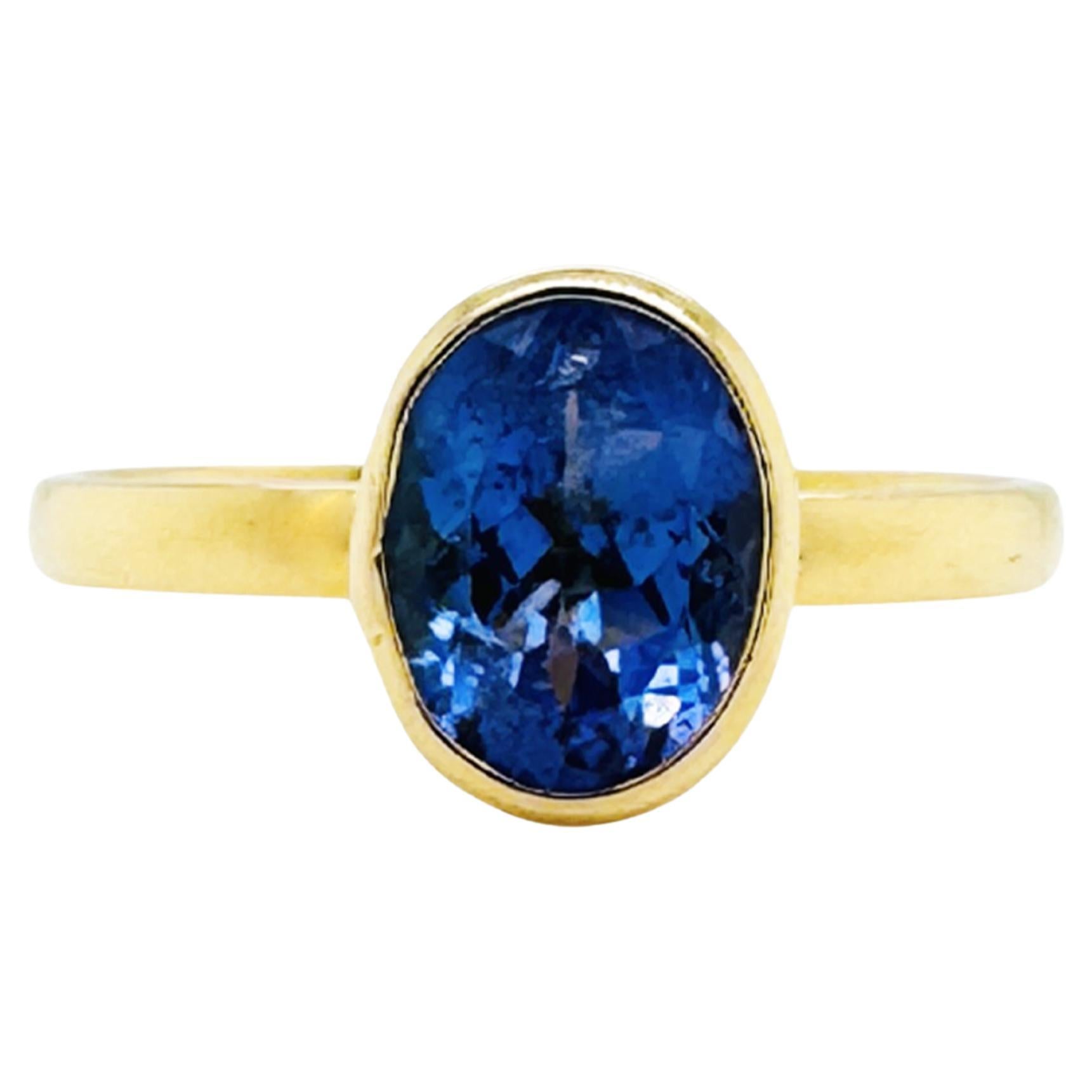 Anello ovale con tanzanite in oro giallo 18 carati