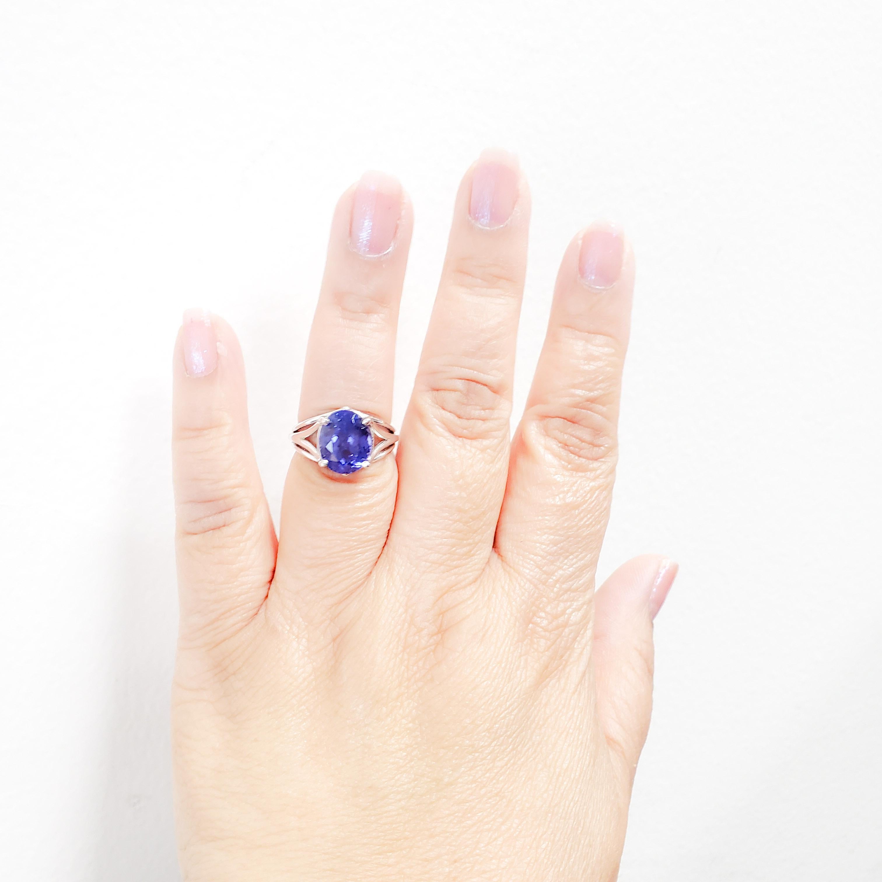 Beautiful tanzanite oval weighing 6.88 ct. in a handmade 14k white gold mounting.  Ring size 7.