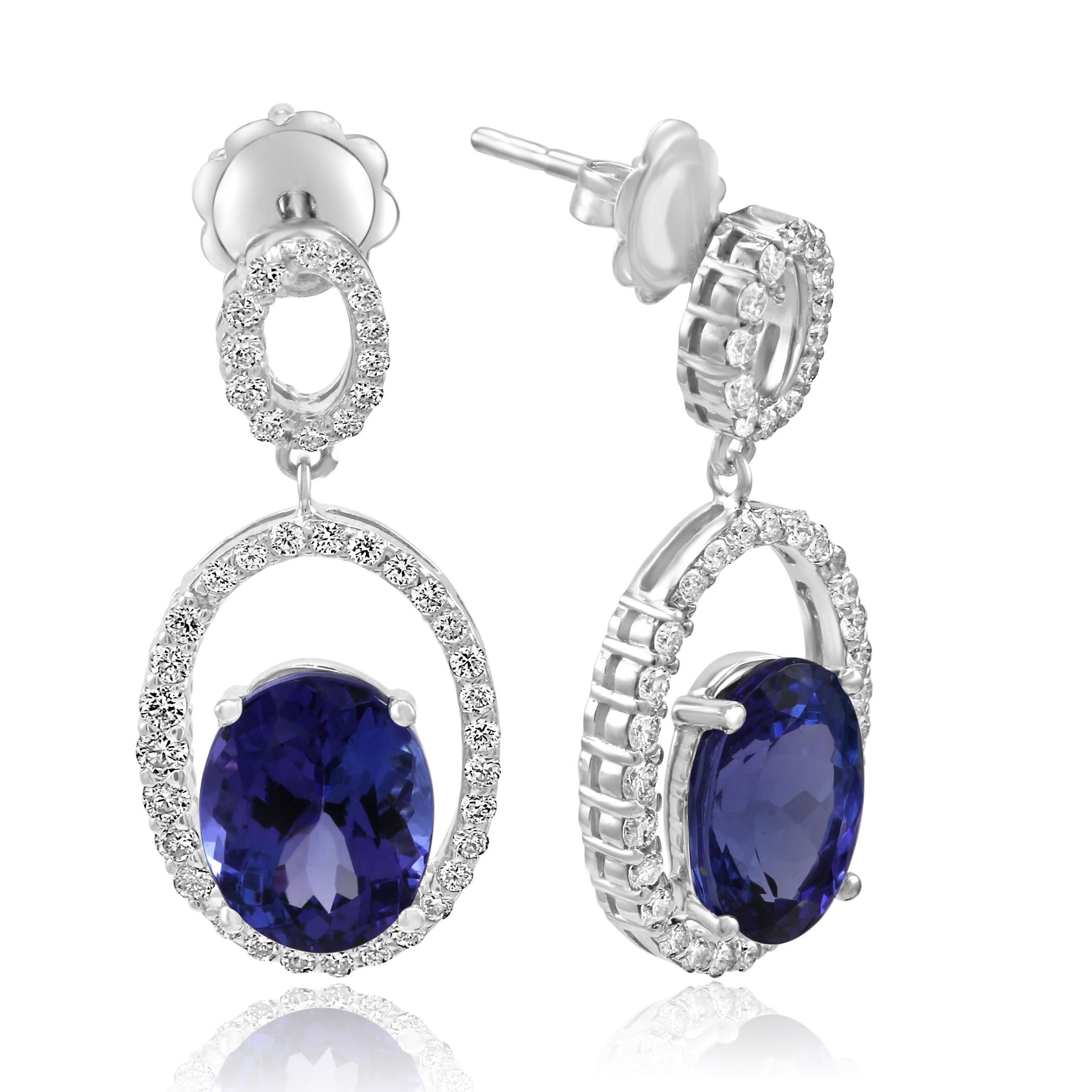 Gorgeous 2 Tanzanite Ovals 6.02 Carats Encircled in Single halo of White G-H Color VS-SI Diamond Rounds 0.78 Carat 14K White Gold Dangle Drop Fashion Earring.

Style available in different price ranges. Prices are based on your selection of 4C's i.e