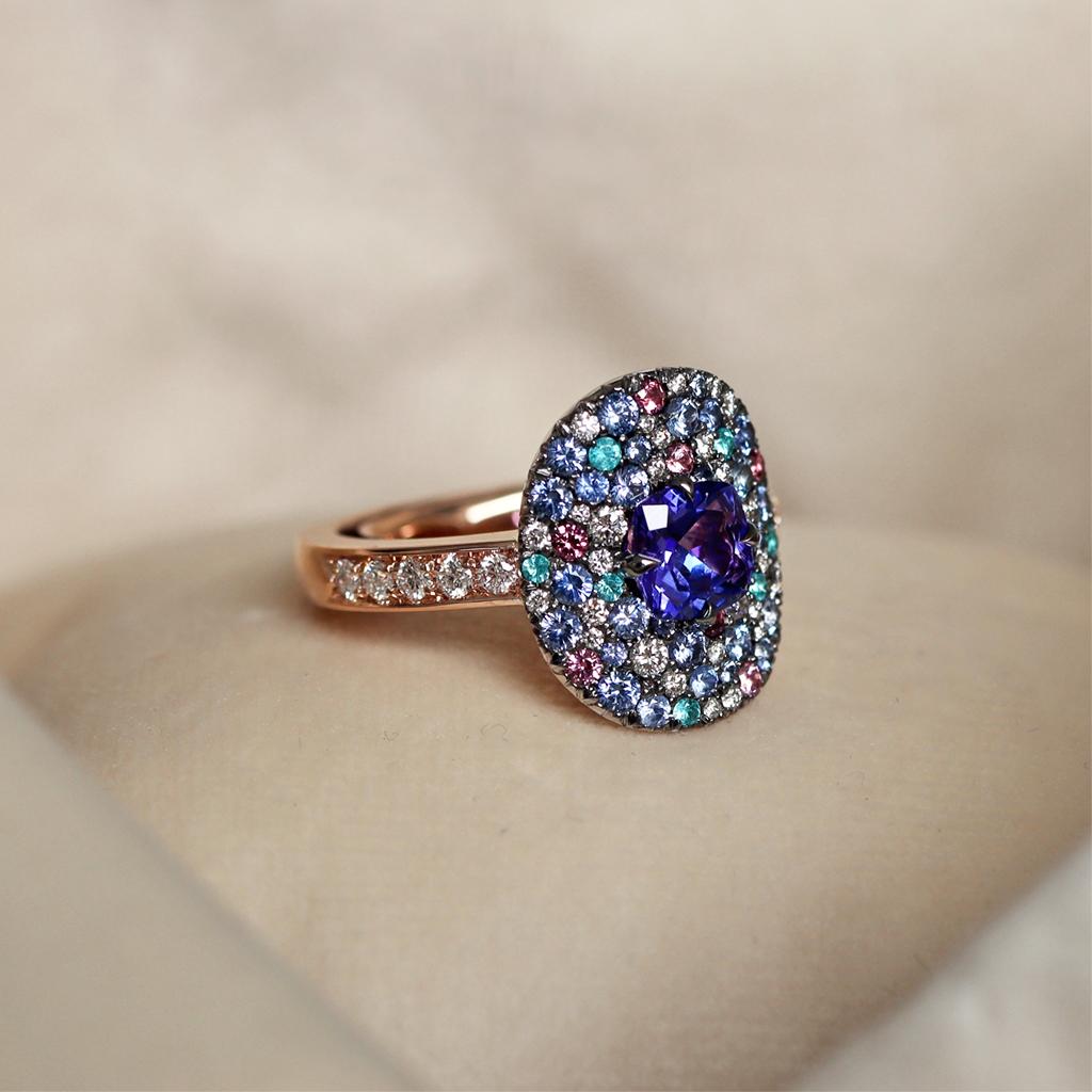 One of a kind Sparkling Ring handmade in Belgium by jewellery designer Joke Quick, and handmade the traditional way, no casting or printing envolved. Ring in 18K White & Rose Gold 13.2 g.  Set with a Cushion-Cut Tanzanite centerstone, pave set