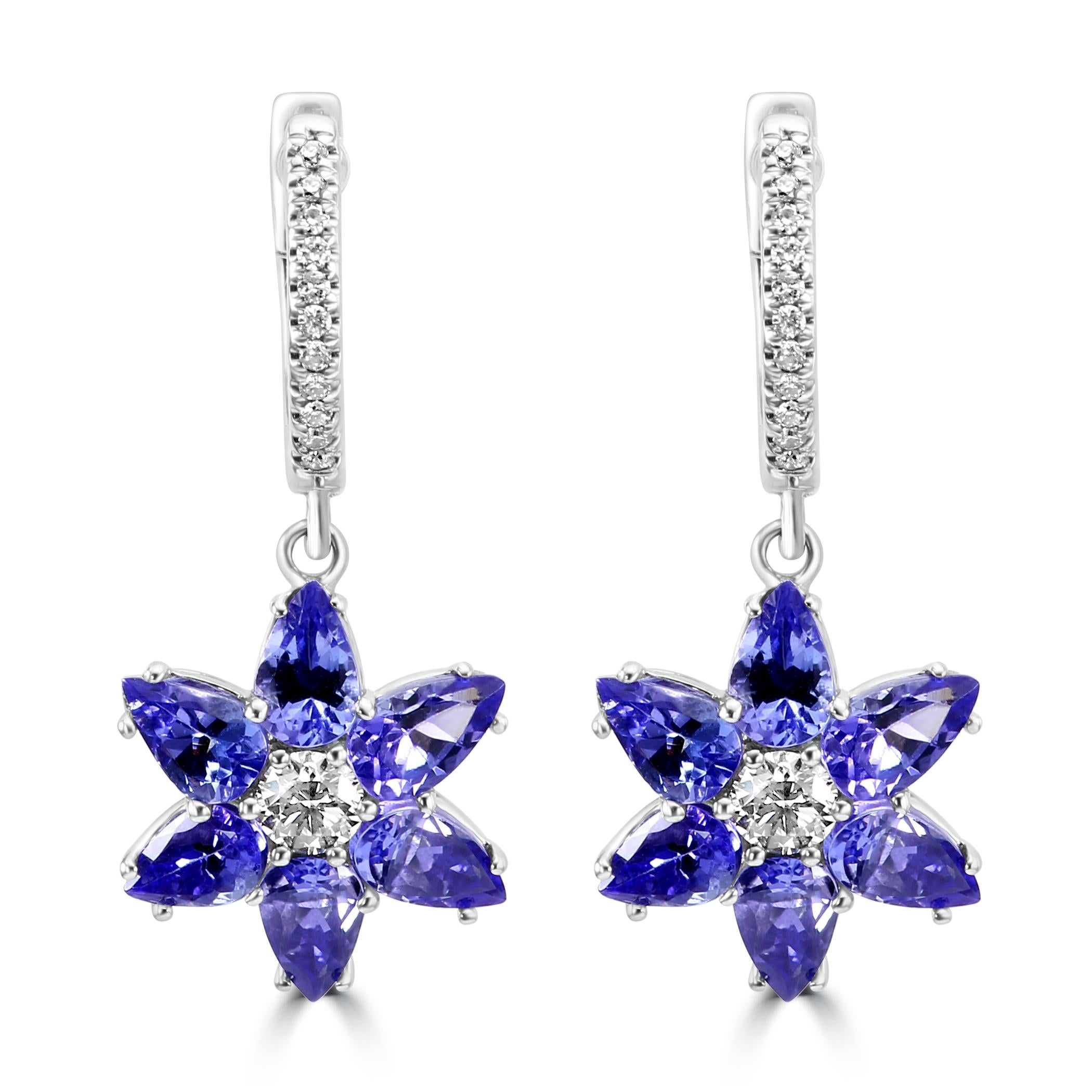 Embark on a journey of floral elegance with our dangling fashion flower-shaped earrings. 

The true beauty of these earrings lies in the intricate flower design crafted from pear shaped Tanzanite's, each petal meticulously set to create a lush and