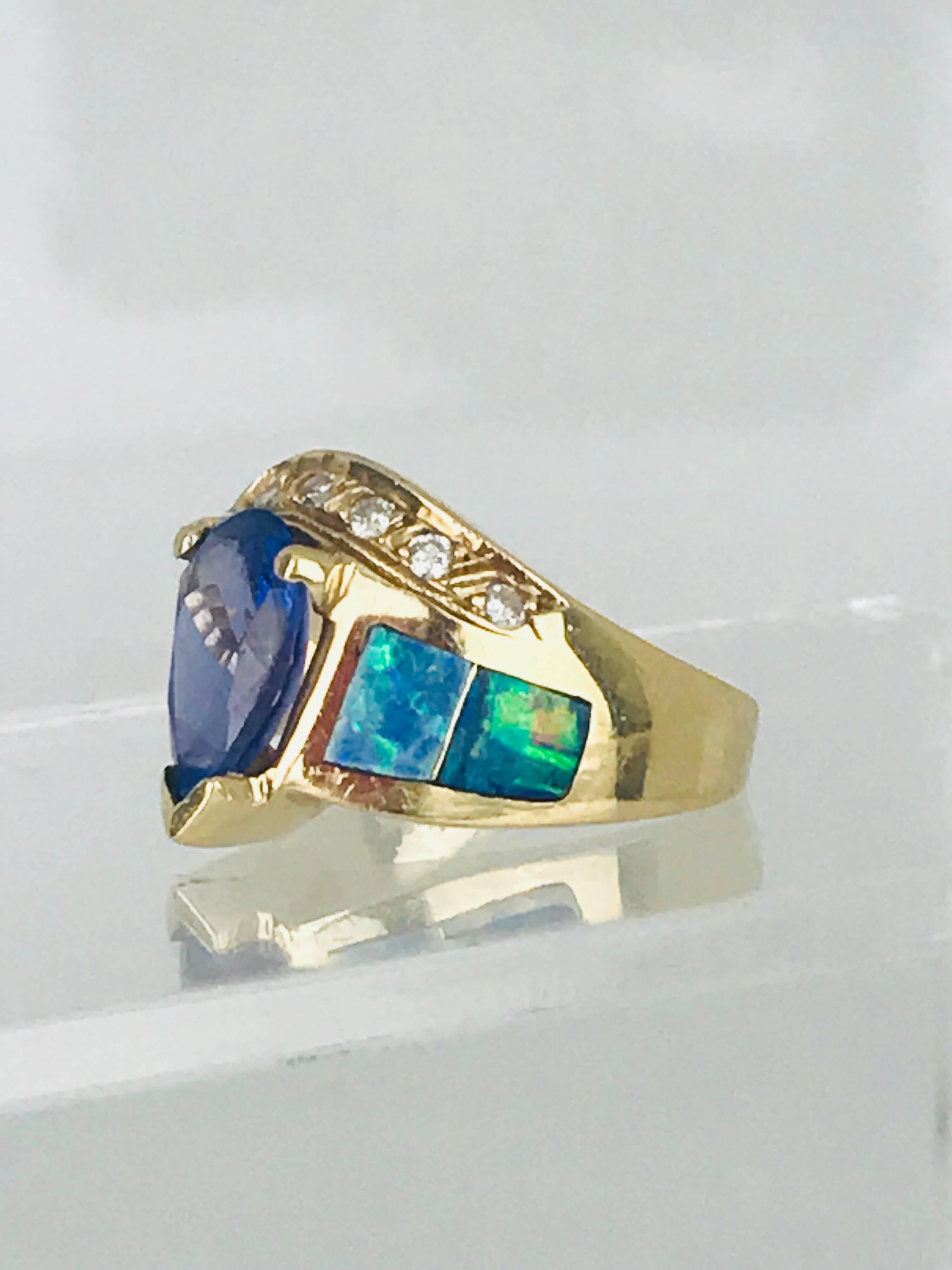 Pear Cut Tanzanite Pear Shaped Ring, Set with Australian Opal and Diamond, circa 1985 For Sale