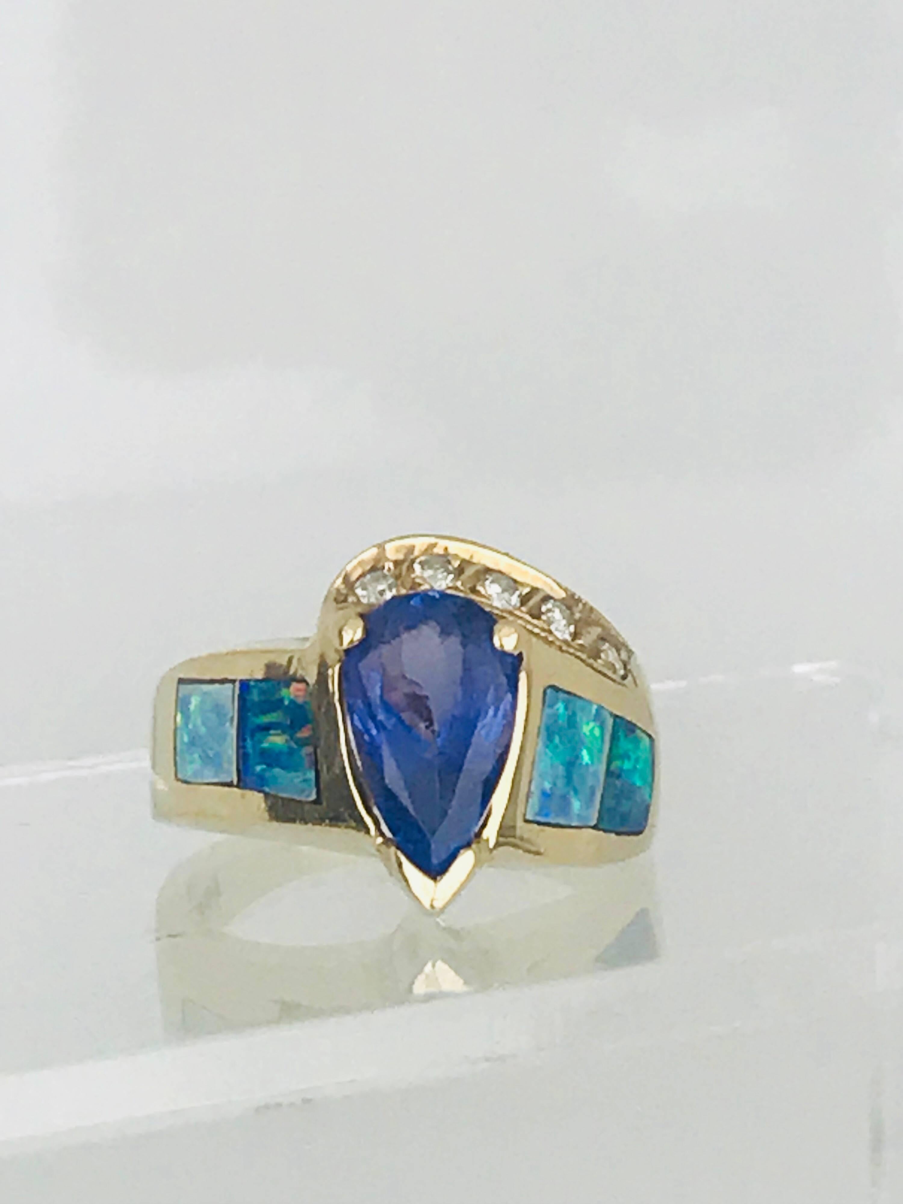 Women's Tanzanite Pear Shaped Ring, Set with Australian Opal and Diamond, circa 1985 For Sale