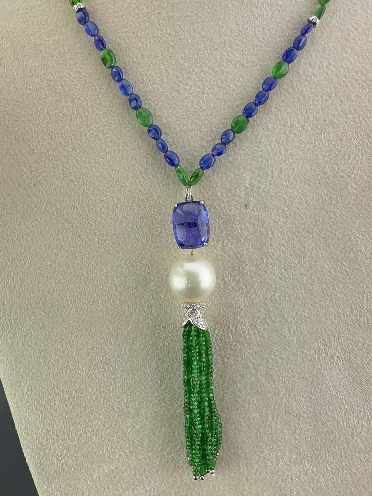 A very unique beaded Sapphire and Emerald necklace, with a Tanzanite, Pearl and Emerald tassle set using White Diamonds and 18K Gold. 