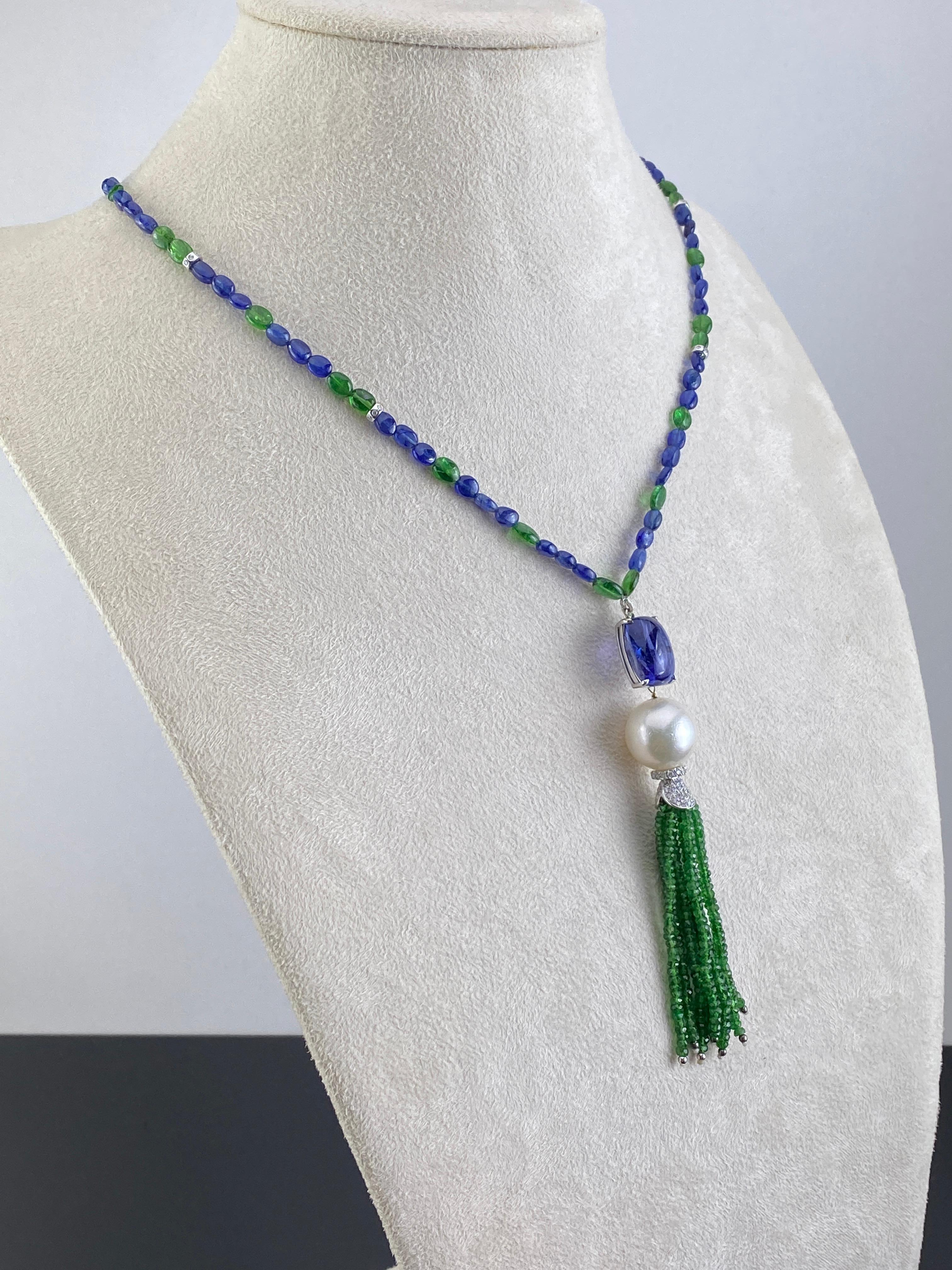 A very unique beaded Sapphire and Emerald necklace, with a Tanzanite, Pearl and Emerald tassle set using White Diamonds and 18K Gold. The chain is currently 26 inches long (not including the pendant), the length can be altered according to your