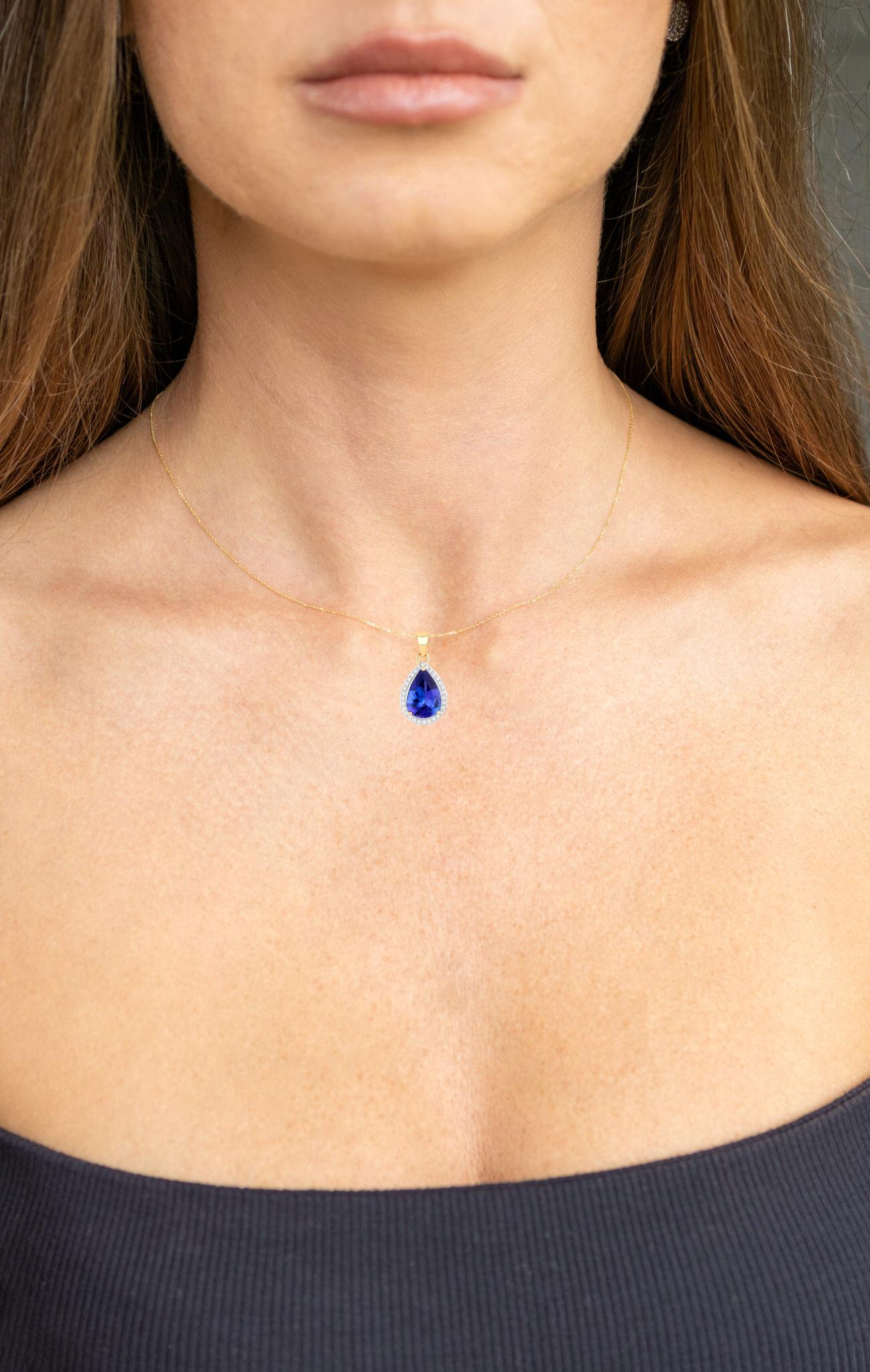 Contemporary Tanzanite Pendant Necklace With Diamond Halo 3.2 Carats Total 14K Gold For Sale