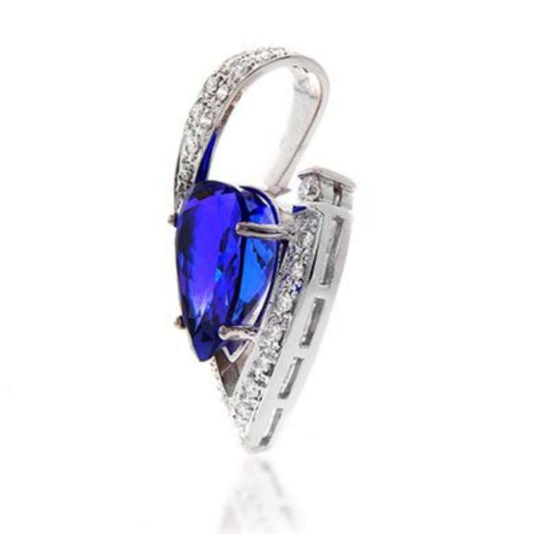 18k White Gold 15.29ct Tanzanite Pendant with 1.03ct Diamonds
An elegant and simple treatment for this diamond and Tanzanite
pendant is all that is needed to let the exquisite center stone shine.
Item: # 00430
Metal: 18k W
Color Weight: 15.29